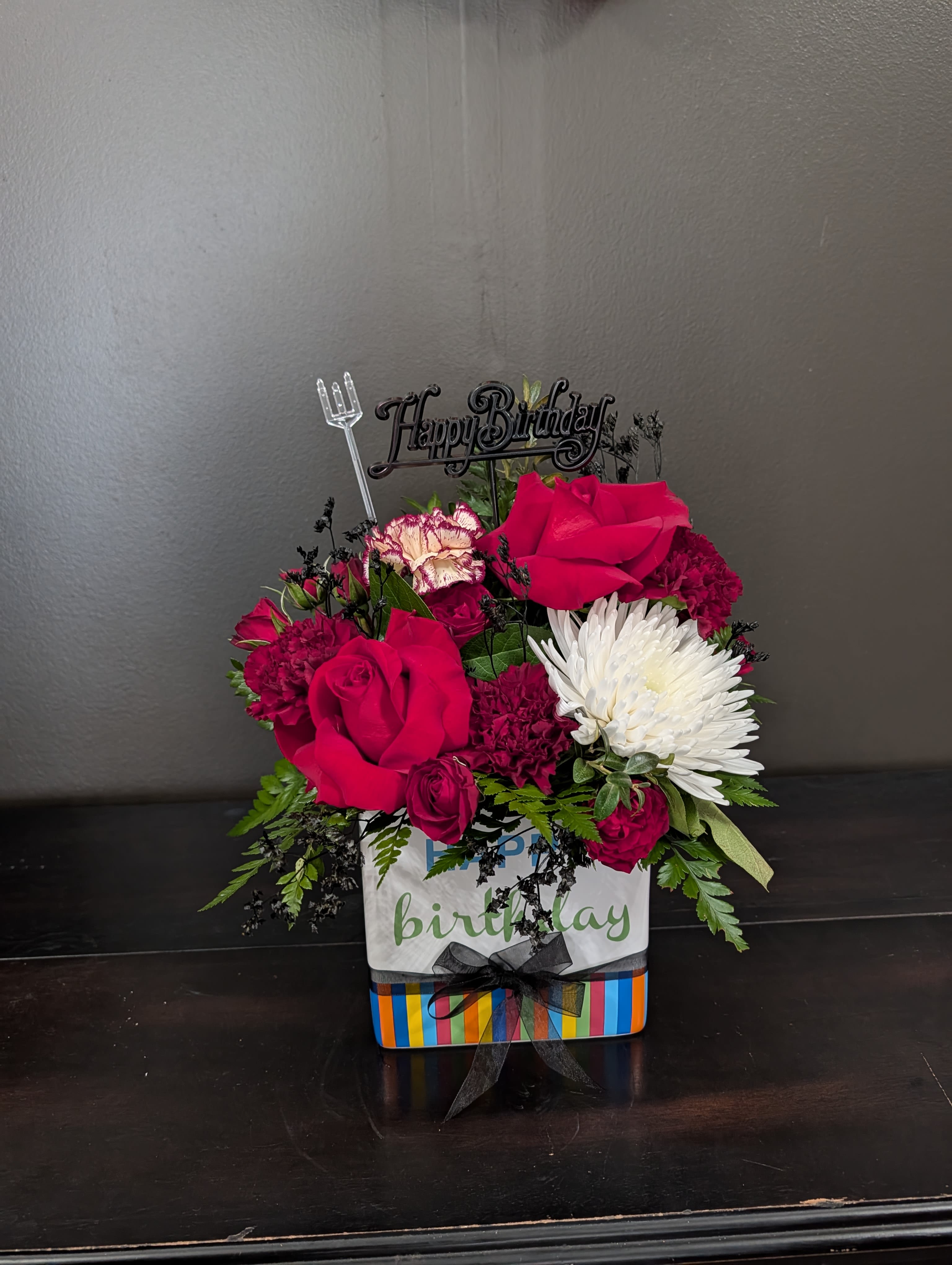 A Moody Birthday - A Moody dark twist on a classic birthday arrangement.  Specific flowers may vary based on availability.