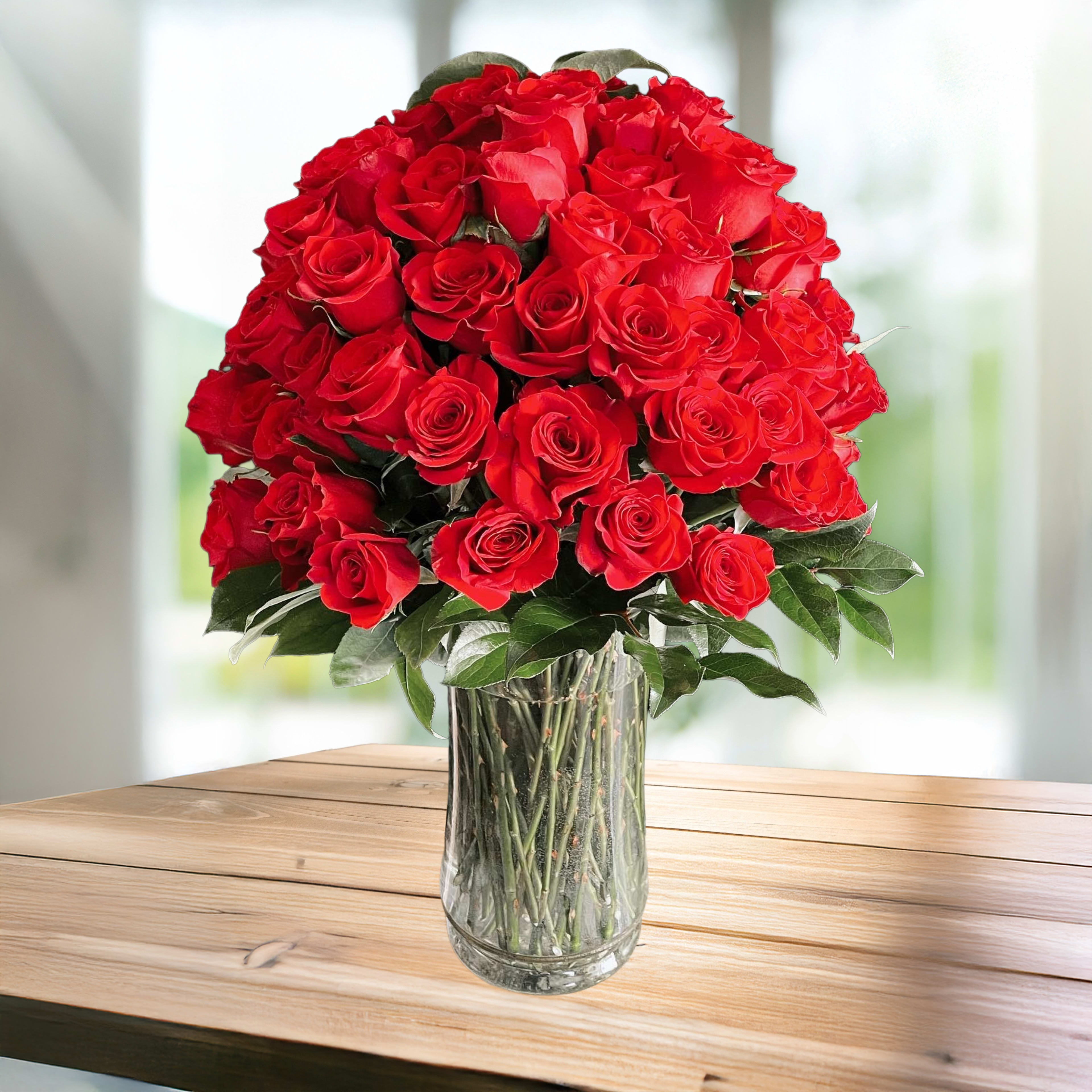 Bouquet of red roses in a clear glass vase