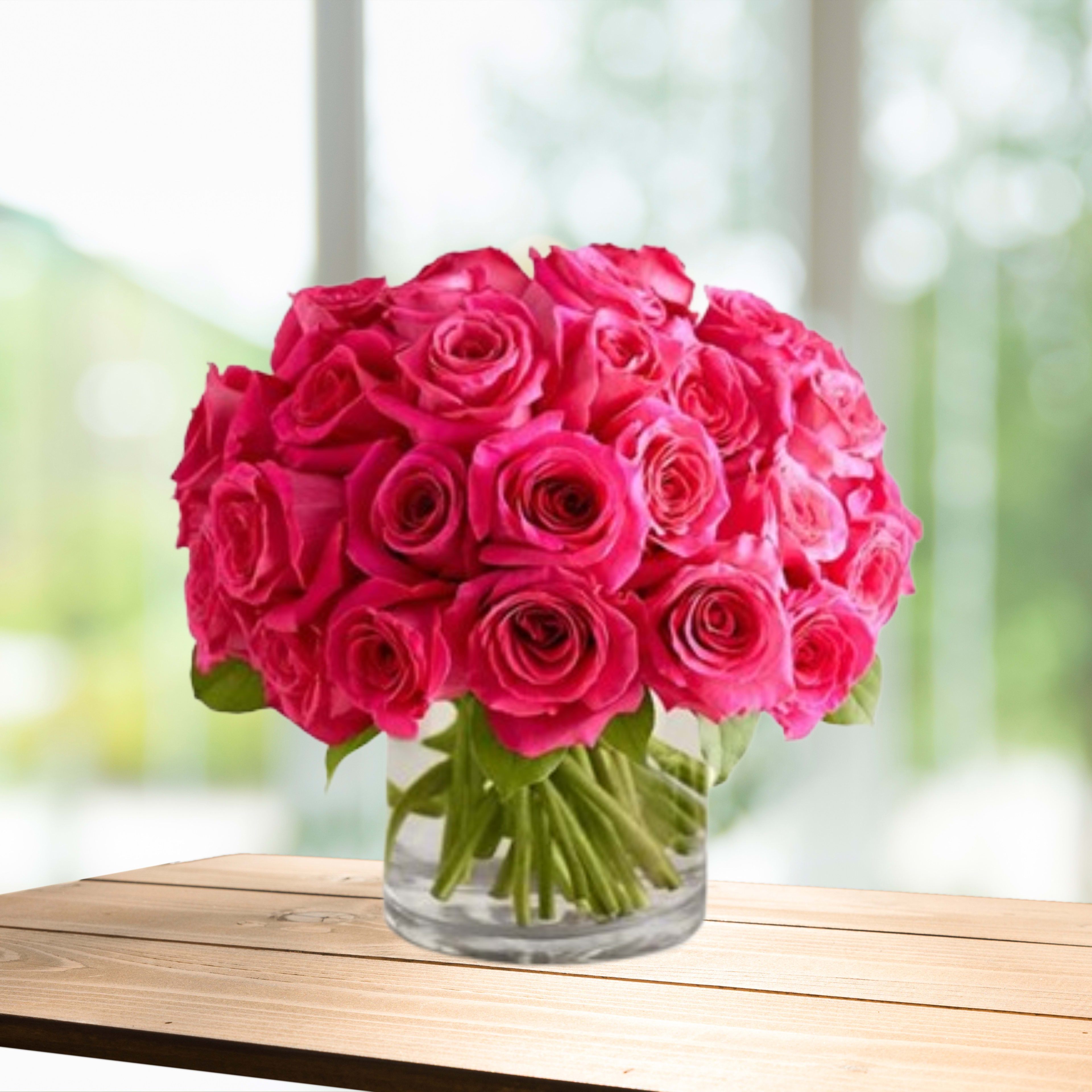 Pink rose bouquet in a clear glass vase