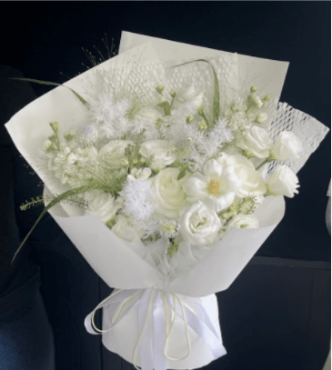 Pure white Dream Flowers - Simply divine! Our "Pure White Cloud" bouquet blends premium white roses and delicate lisianthus with a sprinkle of airy baby’s breath. Wrapped in our signature cloud style, it’s an elegant, clean, and heartfelt gift for any celebration.