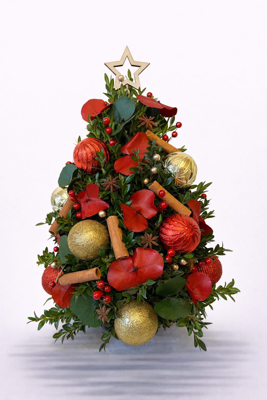 Tree of Joy - A delightful expression of holiday charm and elegance. This unique Christmas tree design blends fresh greens with festive textures, radiant ornaments, and cozy natural elements. Every detail is thoughtfully arranged to evoke the joy, warmth, and beauty of the season — making it a stunning gift or decorative statement.