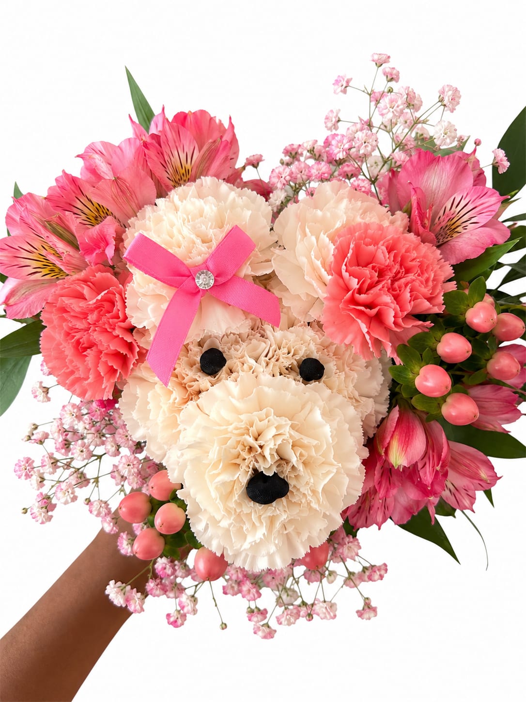 Puppy Love  - Sweet, playful, and impossible not to smile at — Puppy Love is the perfect little bouquet to melt someone’s heart. Handcrafted with soft ivory carnations shaped into an adorable puppy face, accented with rich red blooms, berries, delicate baby’s breath, and lush greenery, this arrangement is wrapped in our signature elegant style with satin ribbon details.  Perfect for anniversaries, birthdays, just because, or anyone who loves something unique and unforgettable. Each bouquet is thoughtfully designed by Idyllic Blooms and may vary slightly, making every puppy truly one of a kind.   Need a special color please add in notes or call in. 