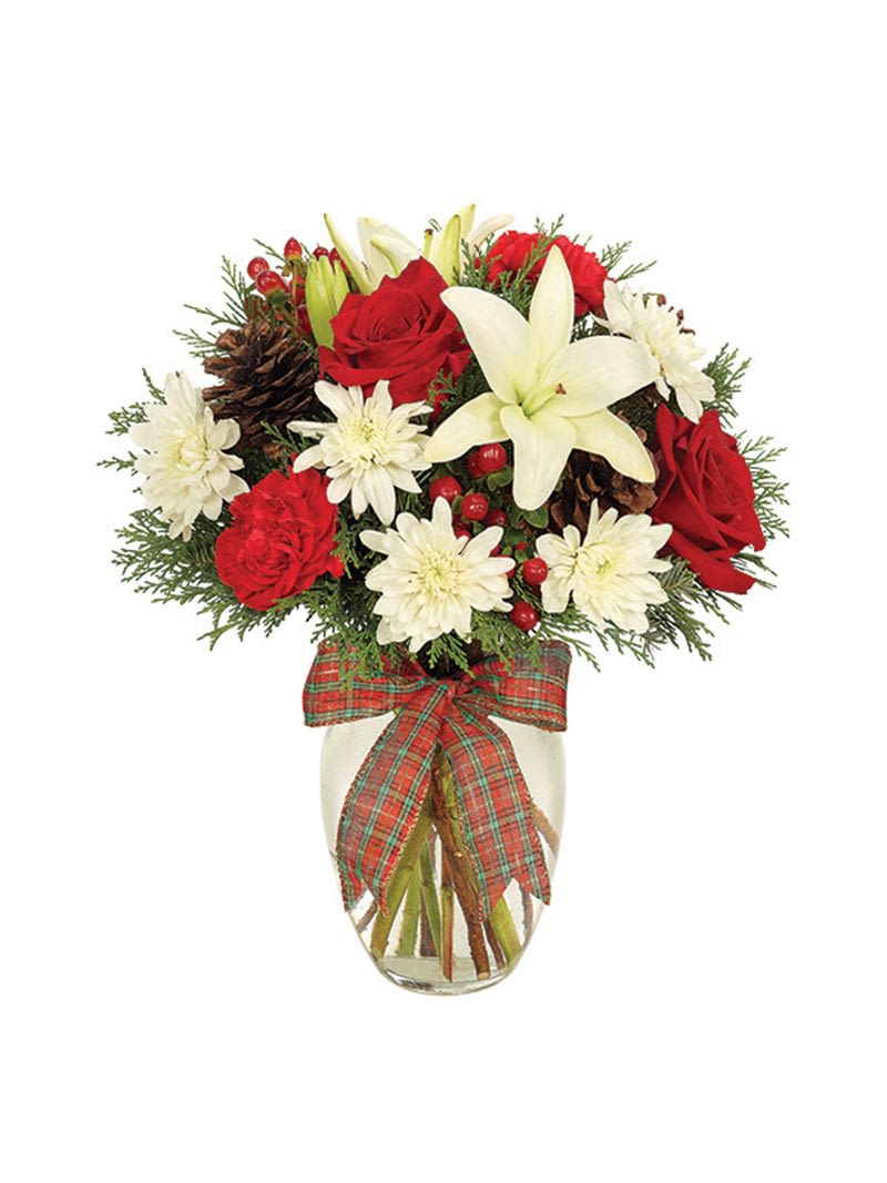 Red roses and white lilies in a glass vase with a plaid bow