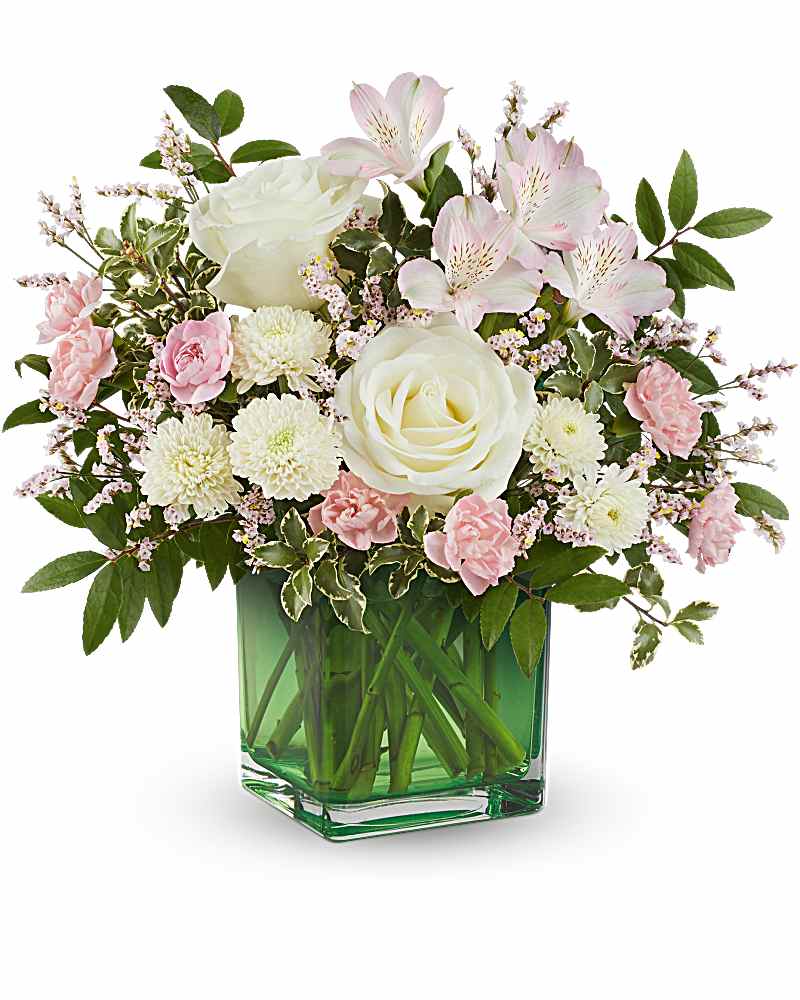 Pink and white bouquet in a green glass vase