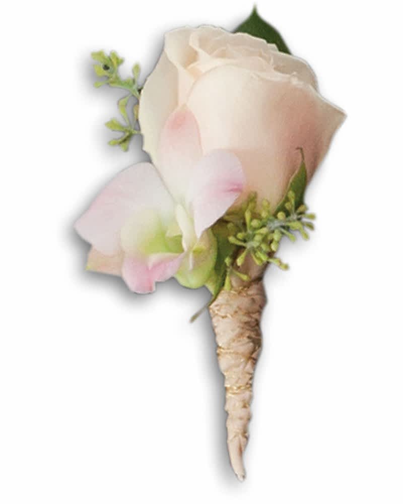Small white and blush boutonniere with green accents