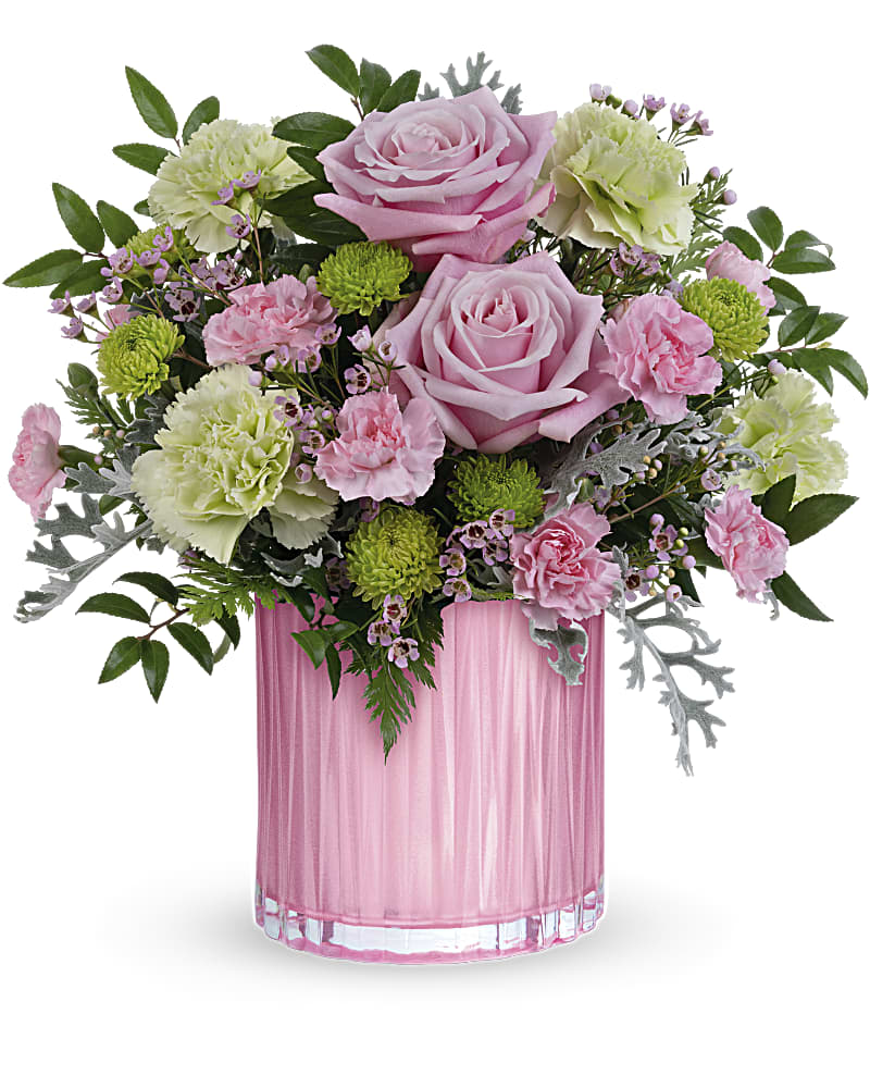 Pink roses and carnations in a pink glass vase