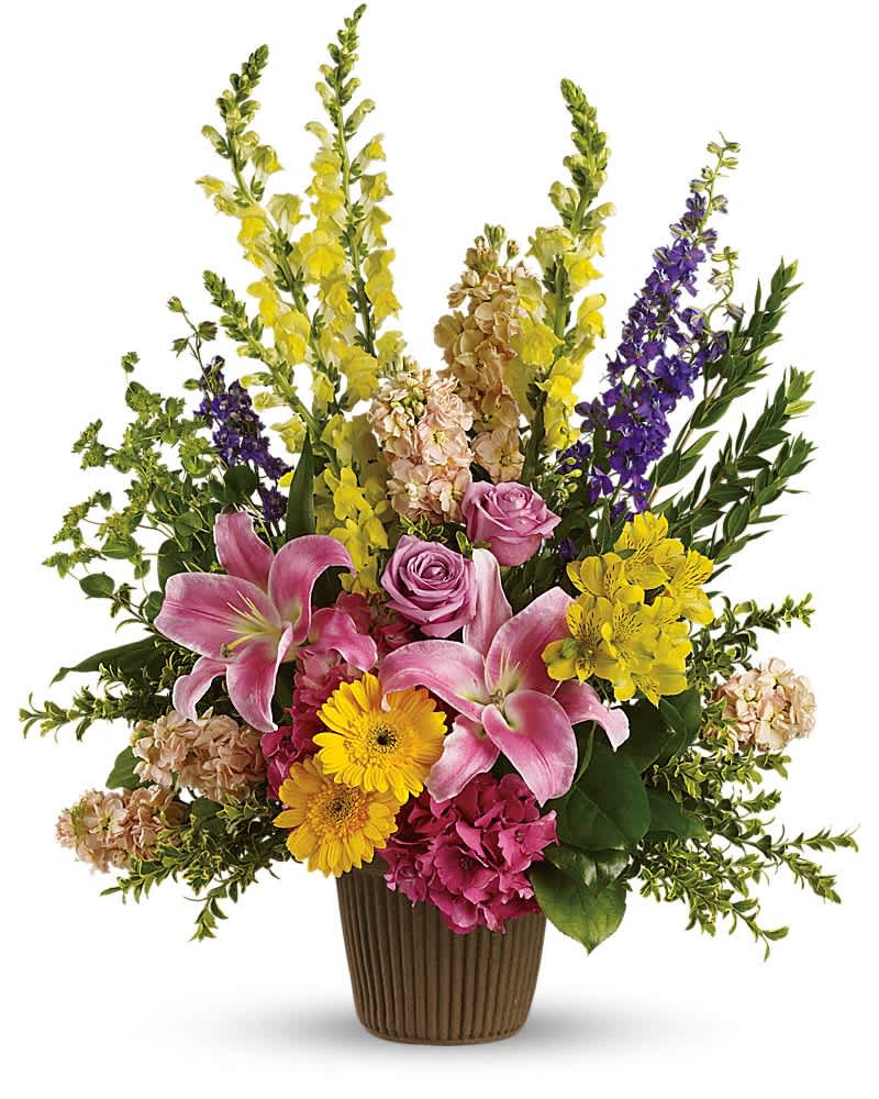 Mixed bouquet in a brown vase with pink lilies, roses, and yellow flowers