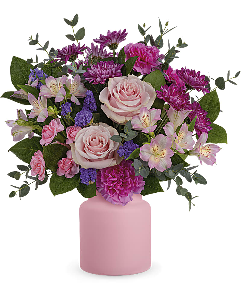 Pink and purple mixed flower bouquet in a pink vase