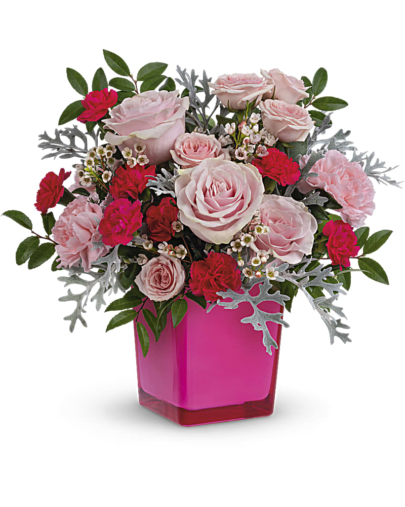 Pink roses and carnations in a bright pink vase