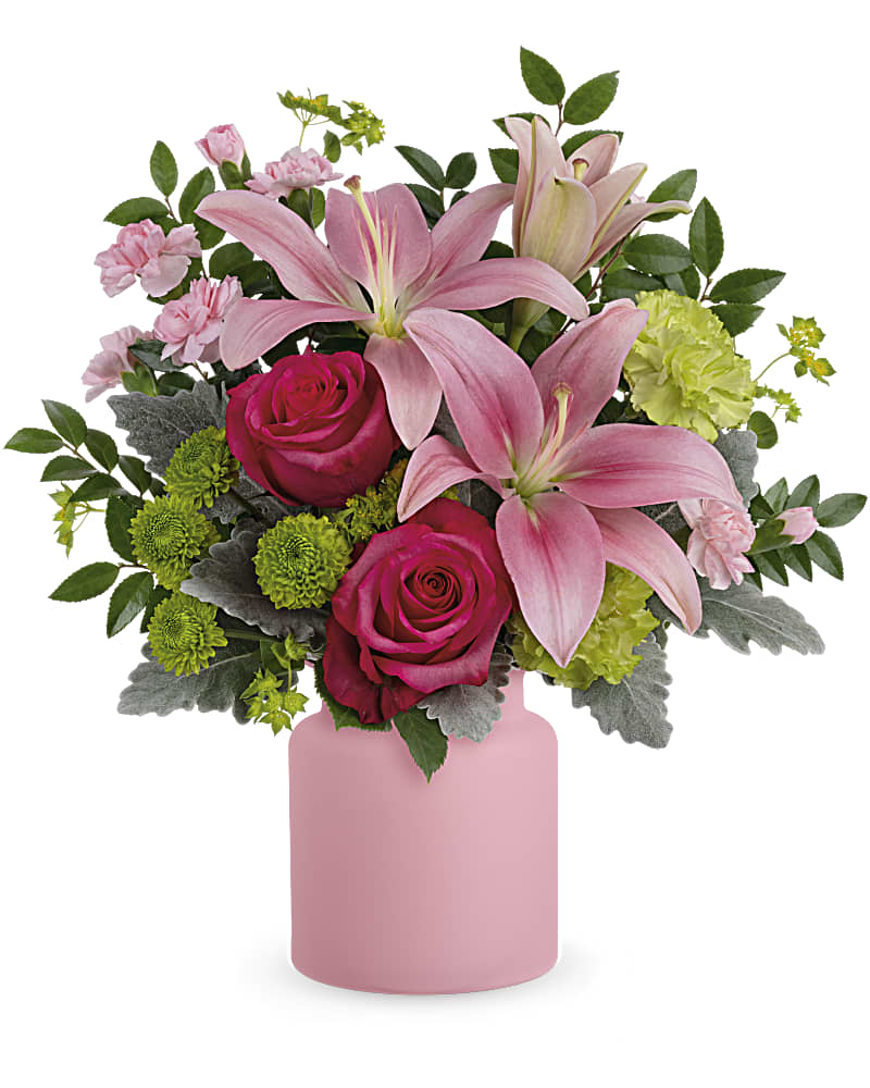 Pink lilies and roses in a pink vase