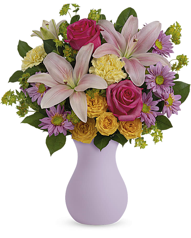 Bouquet of pink lilies, roses, and purple daisies in a lavender vase