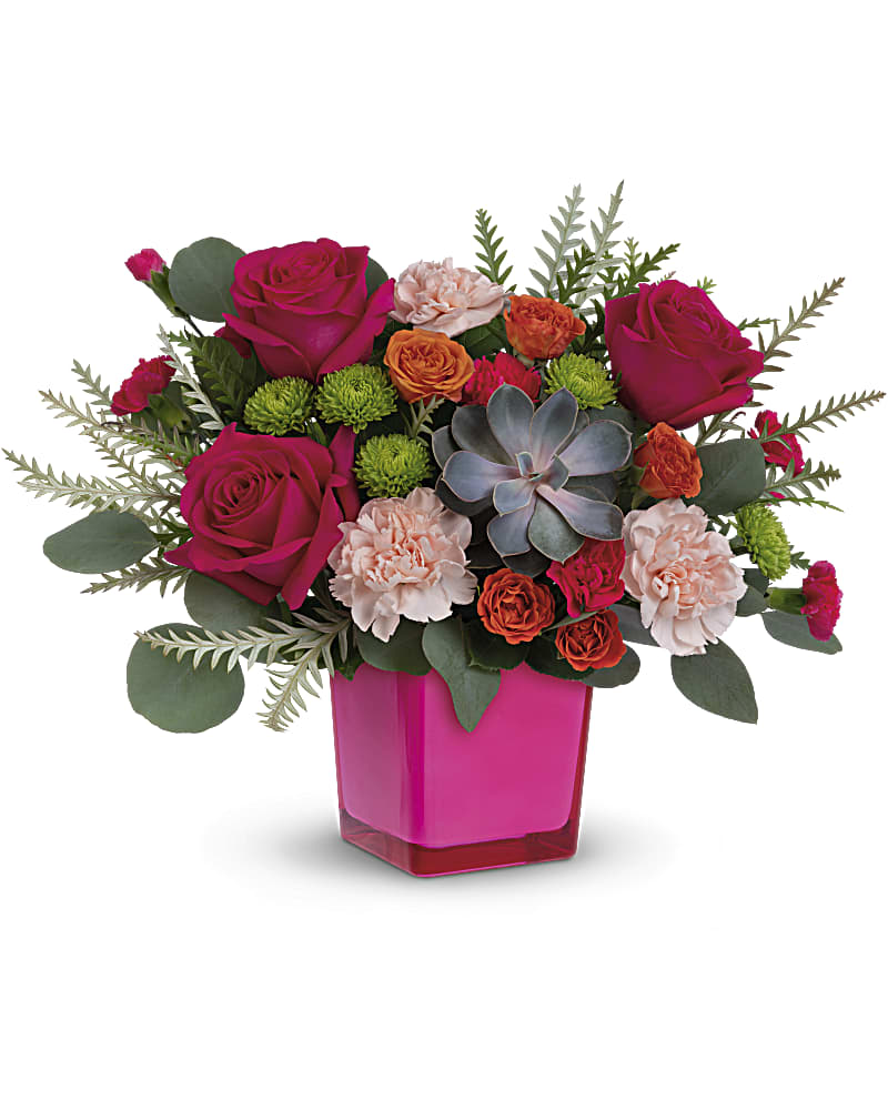 Pink and orange floral arrangement in a magenta vase