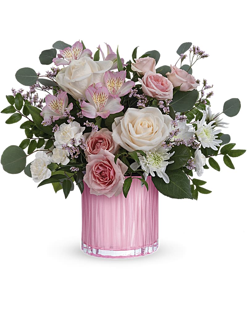 Pink and white roses with alstroemeria in a pink glass vase