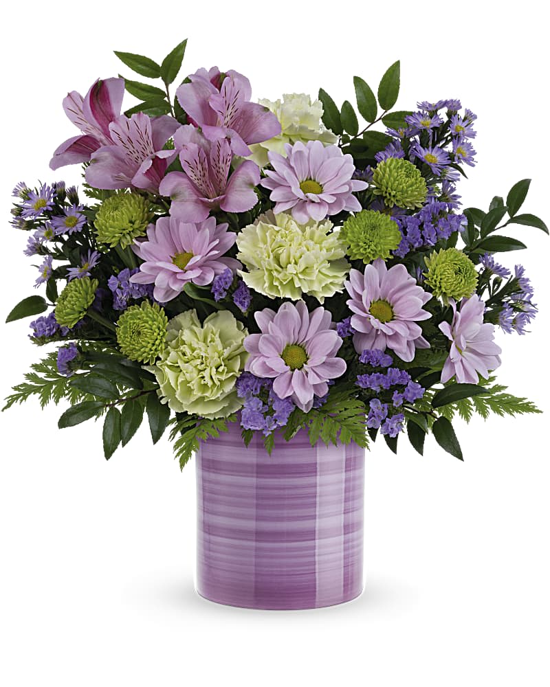 Pink and purple mixed bouquet in a lavender vase