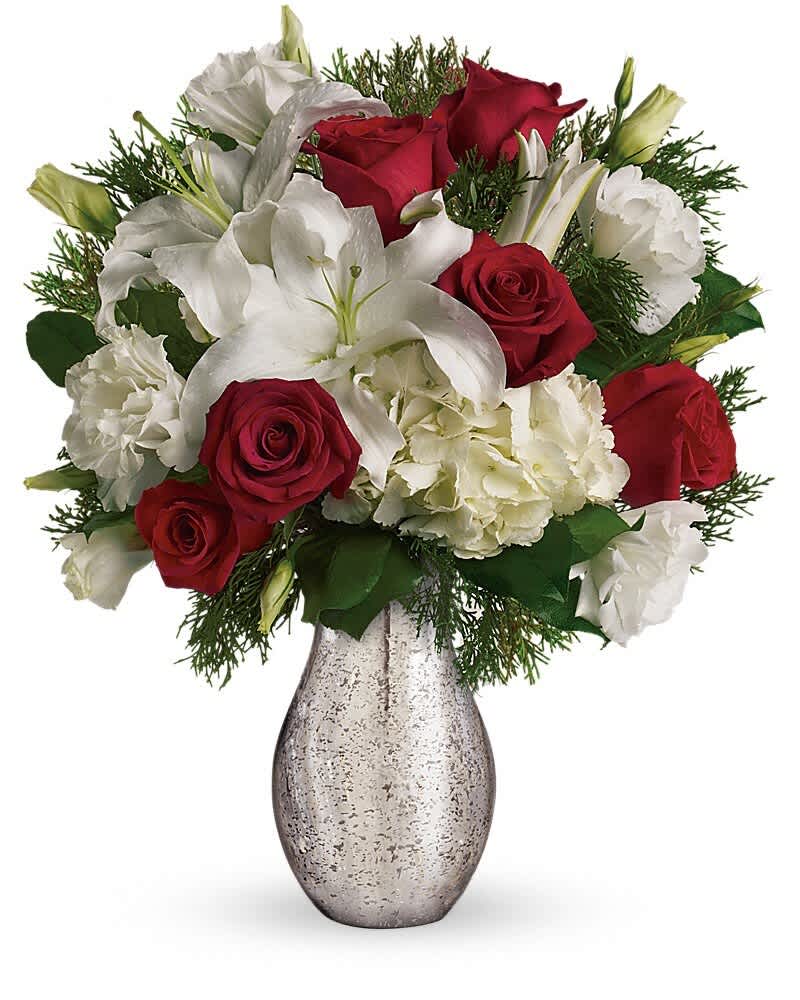 Red roses and white lilies arranged in a silver vase