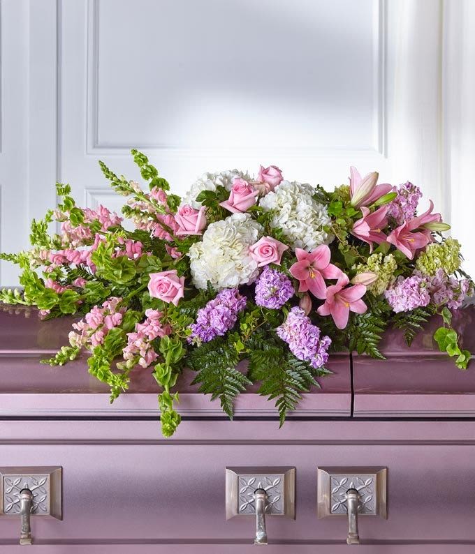 Heart's Tenderness Casket Spray - This soft, pastel-toned tribute is a dignified way to express heartfelt gratitude and eternal love.