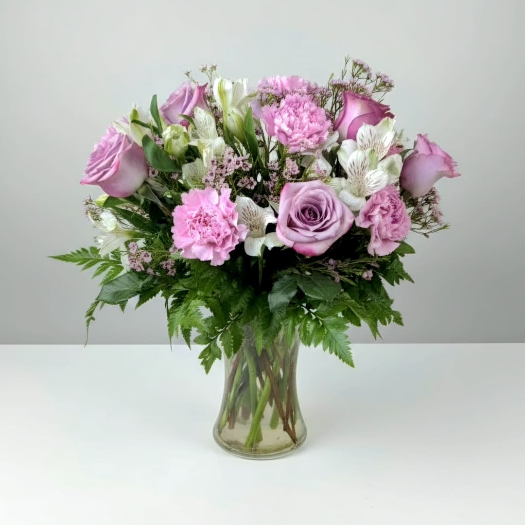 Pink and white mixed bouquet in a clear glass vase