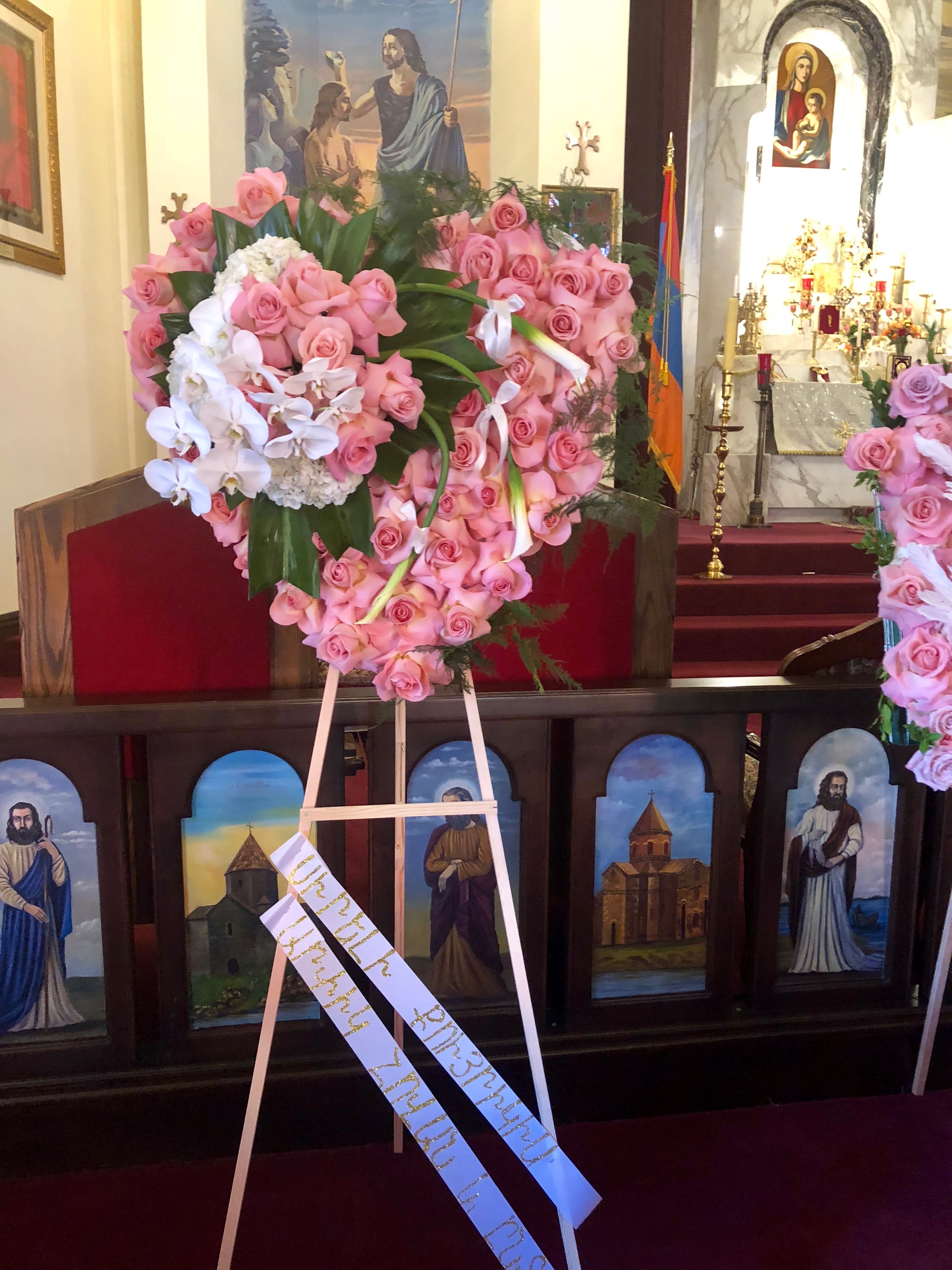 Sympathy Pink Heart -  Santa Clarita Valley Florist - This beautiful piece has Roses, Orchids, and a touch of Hydrangeas and is a Sympathy masterpiece. 