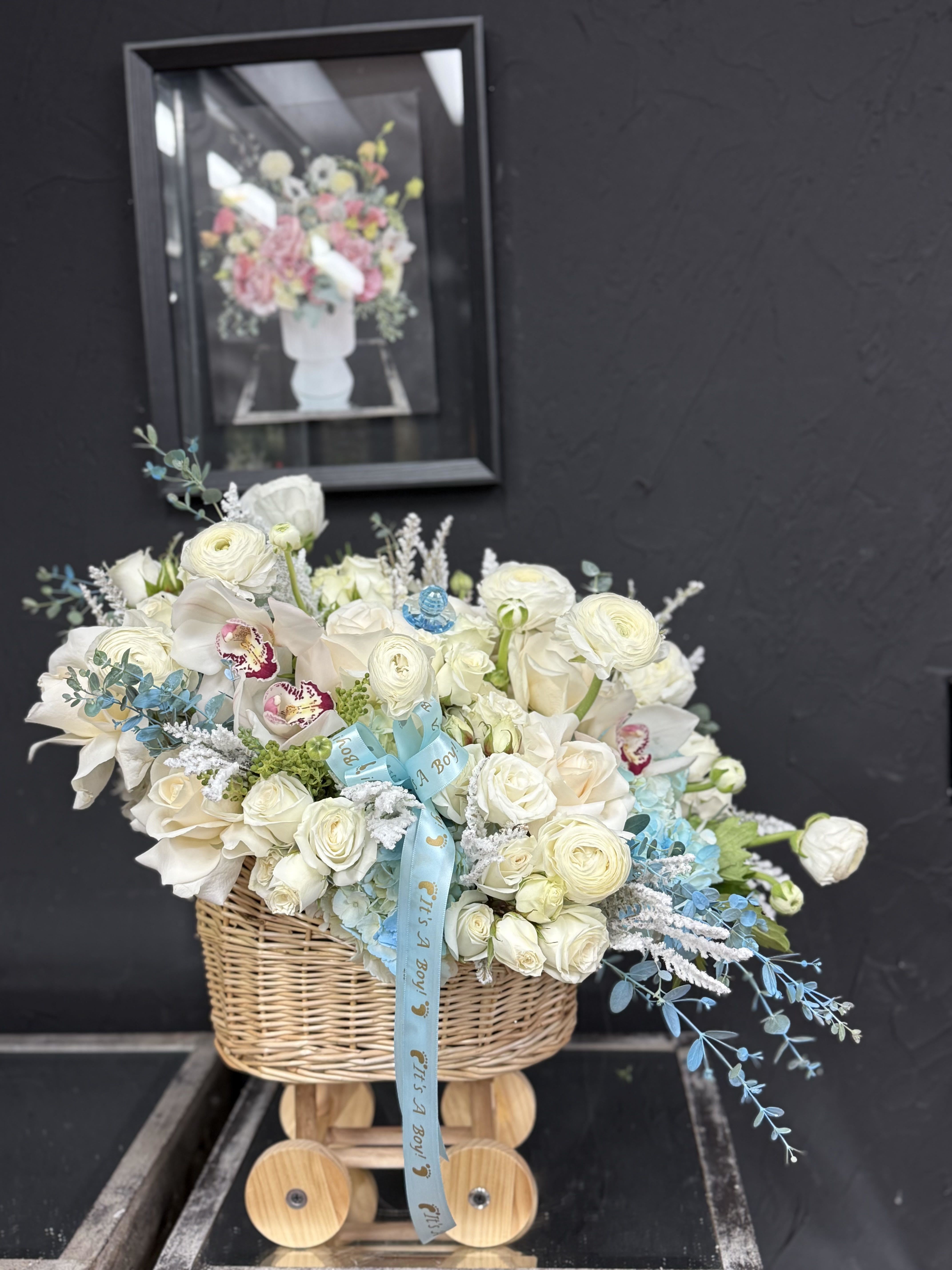 For Your Boy - An elegant floral arrangement featuring a blend of pure white and vibrant blooms. Perfectly balanced in color and style, it brings freshness, beauty, and a touch of sophistication to any occasion.