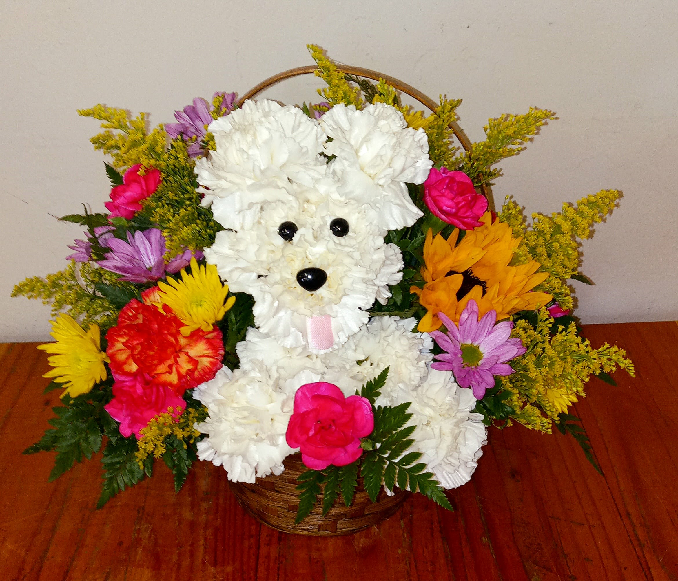 Playful Pup Fresh Flower Arrangement - The Playful Pup Fresh flower arrangement showcases vibrant blooms thoughtfully arranged in the shape of a dog. Designed for long-lasting freshness, its bright palette brings a cheerful touch to any space or occasion.
