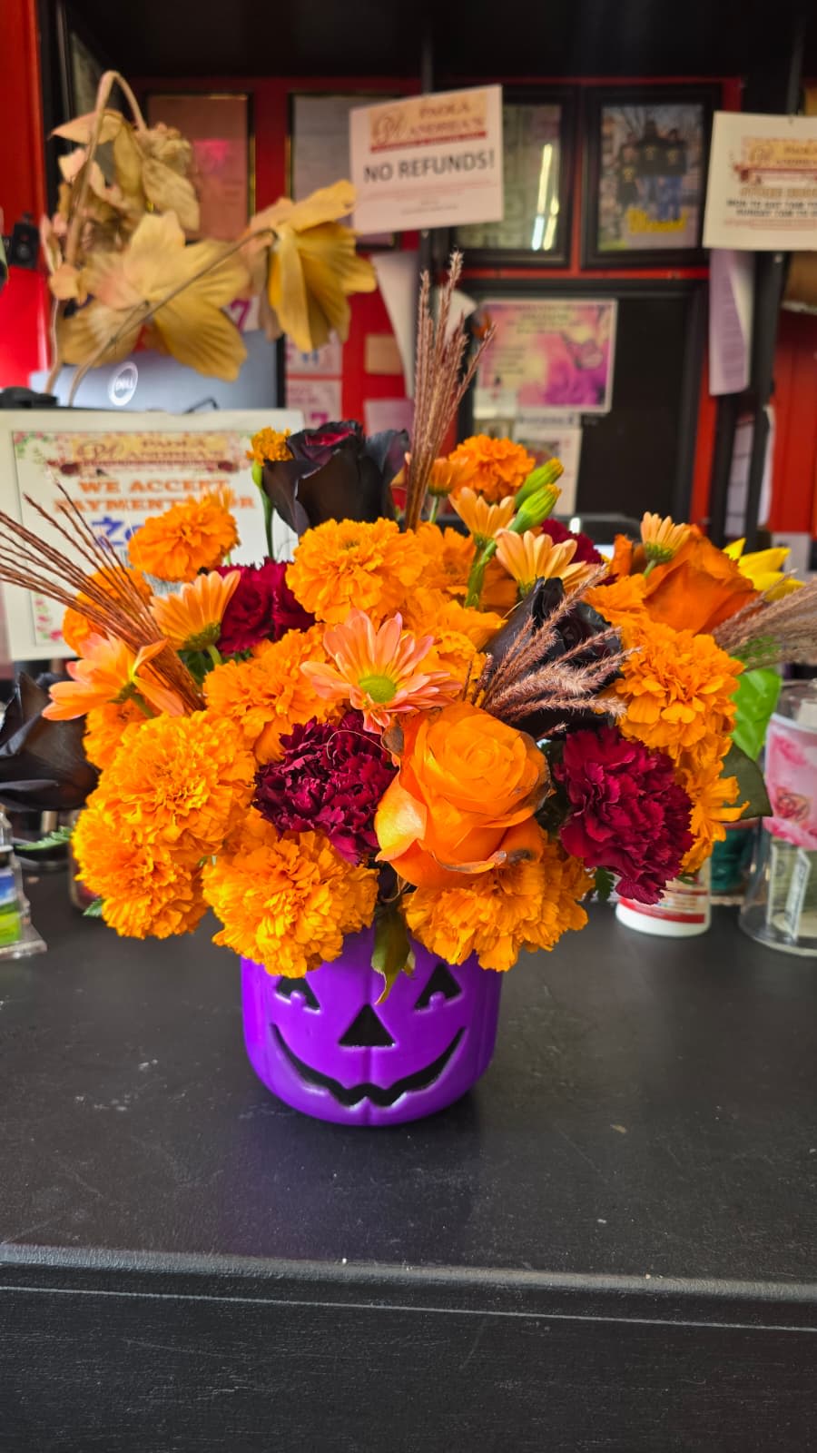 Halloween Trick or Treat Basket arrangement - Catch your closest friends and family off guard with this exclusive Halloween arrangement to show how creative and decorative Halloween can really get while also perhaps makin some scream in delight!!