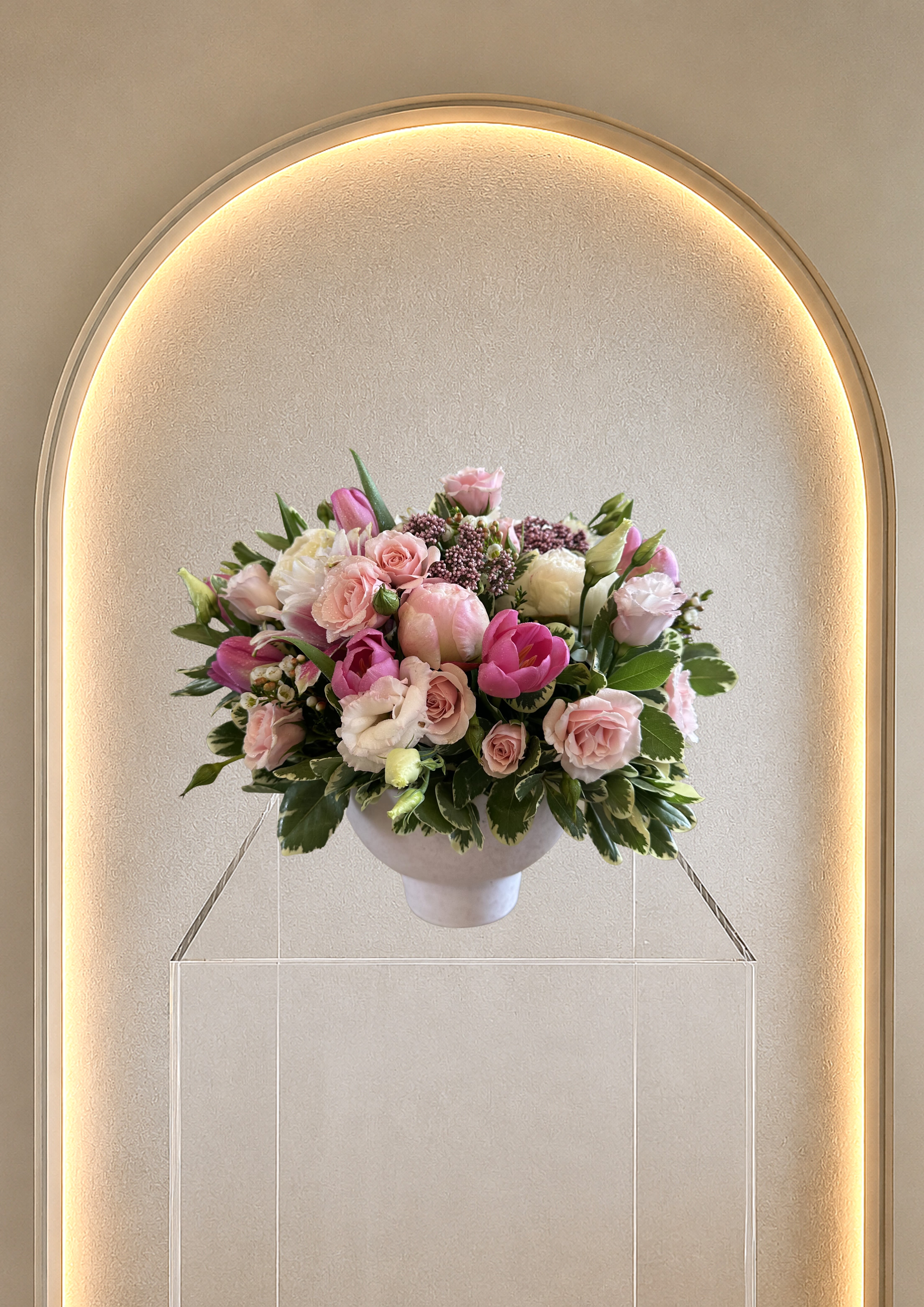 Blooming Beauty - Compact and abundant flowers in soft pink and white blooms with touches of deep magenta in this rounded arrangement - a romantic centerpiece for an anniversary, elegant birthday arrangement or big celebration.