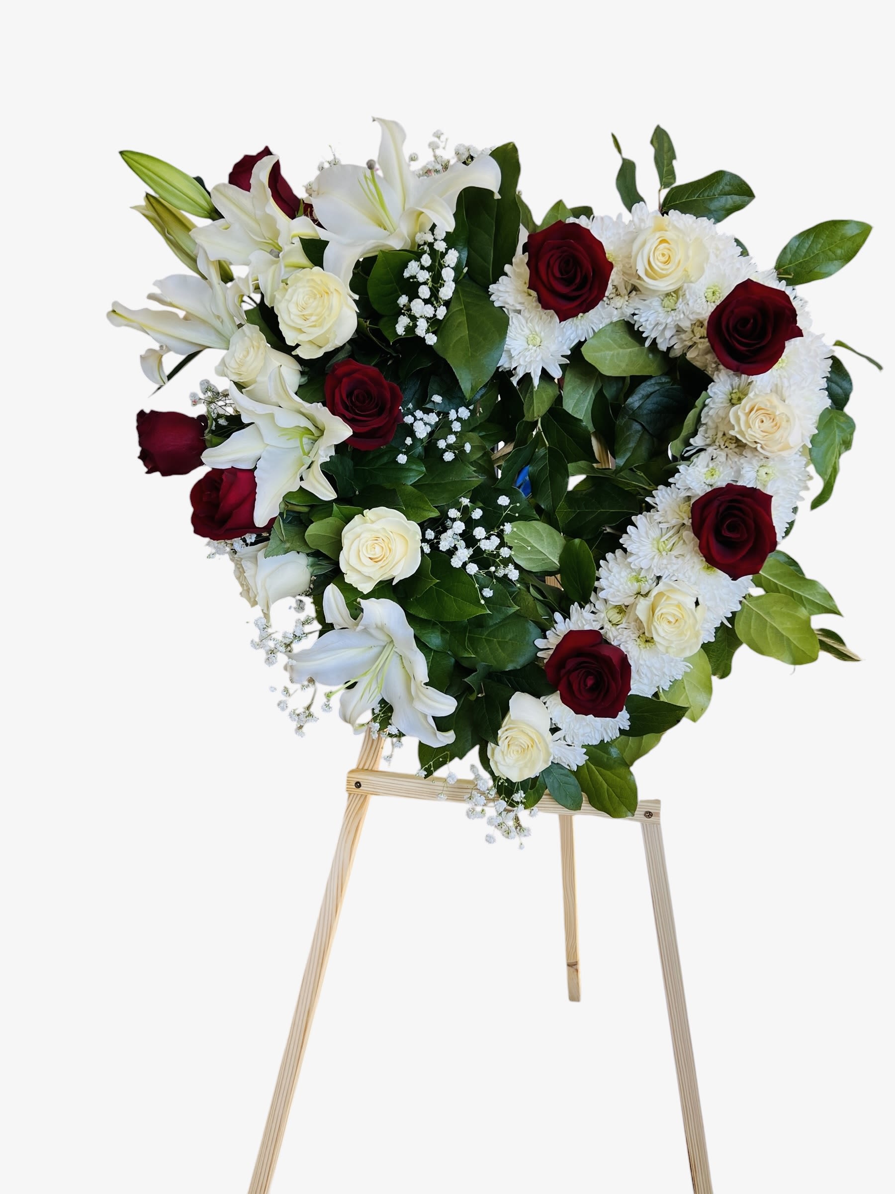 Red &amp; white heart shaped funeral arrangements  - A beautiful heart-shaped arrangement of red and white roses, symbolizing love, respect, and remembrance. A meaningful tribute to honor a life deeply cherished and forever remembered.