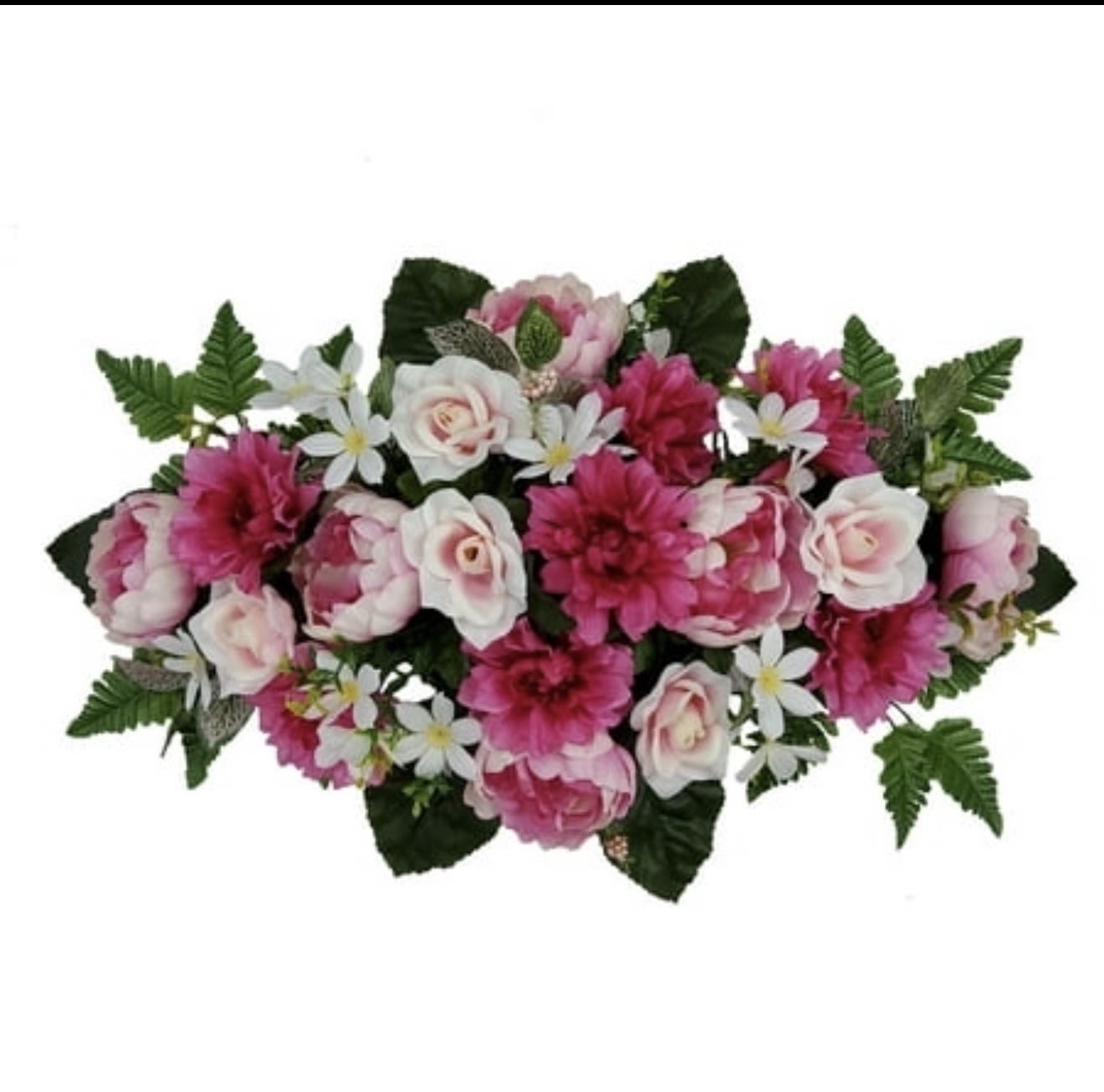 Soft Memories Tribute - Soft, garden-fresh and quietly uplifting, this low, wide flower arrangement is a thoughtful sympathy tribute or a gentle gift for a spring celebration. The design reads as a pink and white bouquet arranged horizontally-perfect as a memorial piece, a bedside remembrance, or a centerpiece that says "I'm thinking of you" without words. The recipient will feel comforted and seen by the arrangement's soft, feminine palette and balanced, calming shape.  A dense cluster of rose-like blooms and fuller pink flowers is punctuated with small white daisy accents and framed by deep green foliage for a lush, garden-style look. The compact, symmetrical design sits low and wide to work as a table display or a mantel arrangement; colors are predominantly soft pinks and bright whites with rich green leaves adding depth and contrast. The overall texture is layered and full, offering visual interest from every angle while remaining neat and composed.  Ideal for sending condolences, marking a gentle anniversary, or brightening someone's day during springtime, this piece arrives ready to display-no tall vase required. Because of its low profile and sturdy shape, it's especially suited for tabletops, reception areas, or close to a bedside where the recipient can appreciate its color and scent up close.