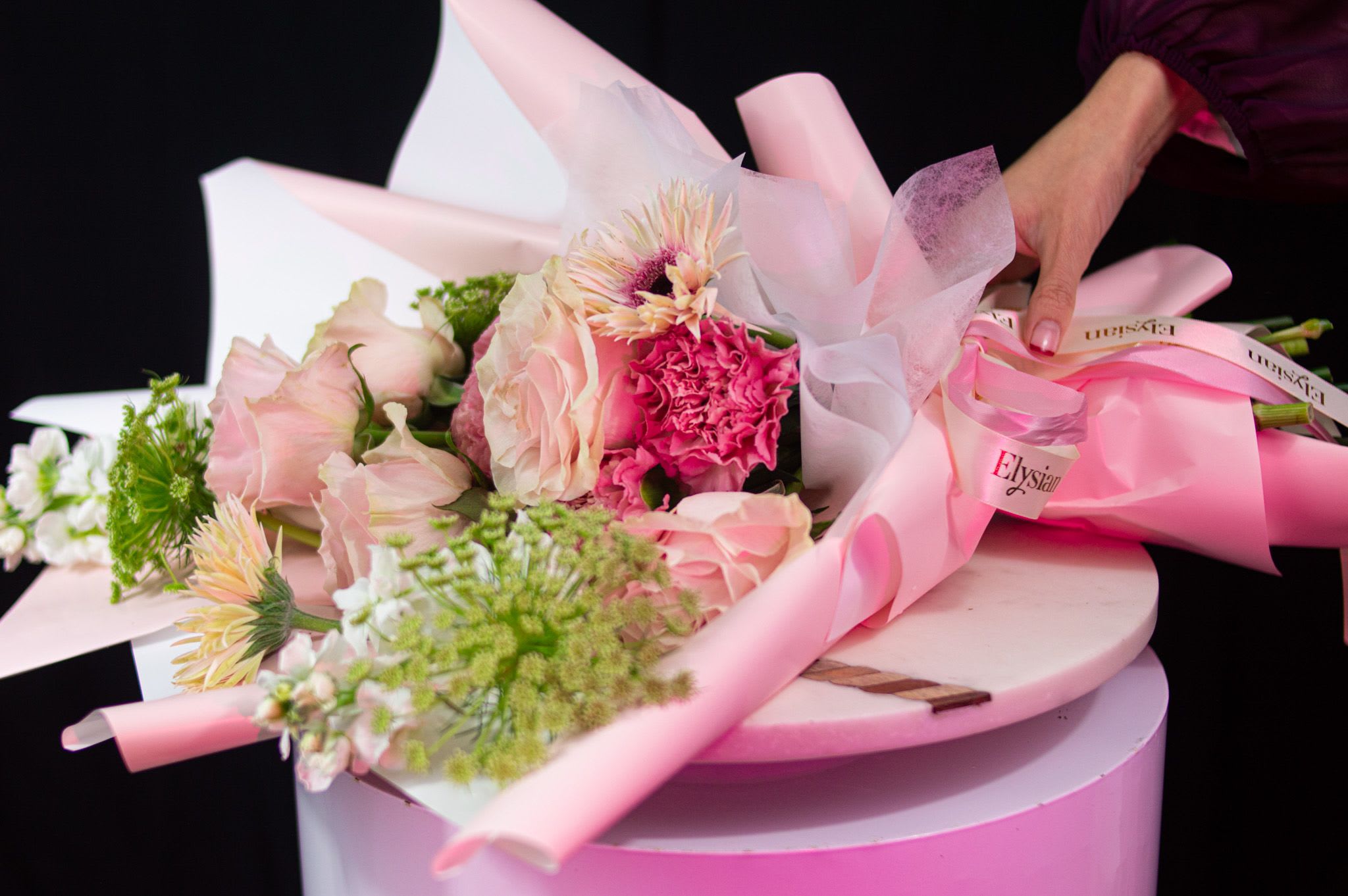 Pinkberry Matcha - A soft expression of love, redefined. This arrangement features blush and nude roses layered with delicate seasonal blooms and fresh green accents, designed in an airy, sculptural form. Light, romantic, and thoughtfully composed, it captures love in its most tender and modern state.  Perfect for those who love quietly, deeply, and beautifully.  Disclaimer: Due to the seasonal nature of flowers, we take the liberty of selecting the freshest blooms available. Flower varieties may vary, but we always ensure the arrangement maintains the same color palette, style, and overall aesthetic.