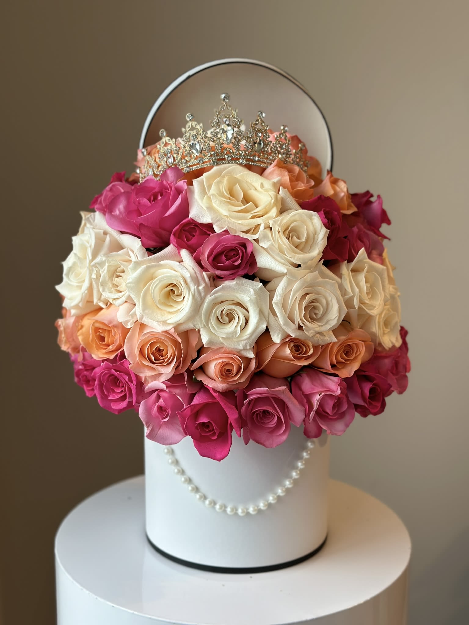 La Vie en Rose - Introducing the La Vie en Rose, a signature arrangement from the house that embodies luxury and sophistication. This stunning arrangement features 50 exquisite Ecuadorian roses, each showcasing a captivating palette of pink hues. Known for their exceptional quality and vibrant colors, these roses are a symbol of beauty and grace. Meticulously curated at a 180-degree angle, this bouquet ensures a breathtaking display from every viewpoint. Each rose is perfectly positioned, creating a harmonious and visually stunning presentation.  Meticulously curated at a 180-degree angle, this bouquet ensures a breathtaking display from every viewpoint. Each rose is perfectly positioned, creating a harmonious and visually stunning presentation.  Perfect for special celebrations, romantic gestures, or to make an unforgettable impression, this unique design is a testament to the exceptional quality and artistry that define our house specials.