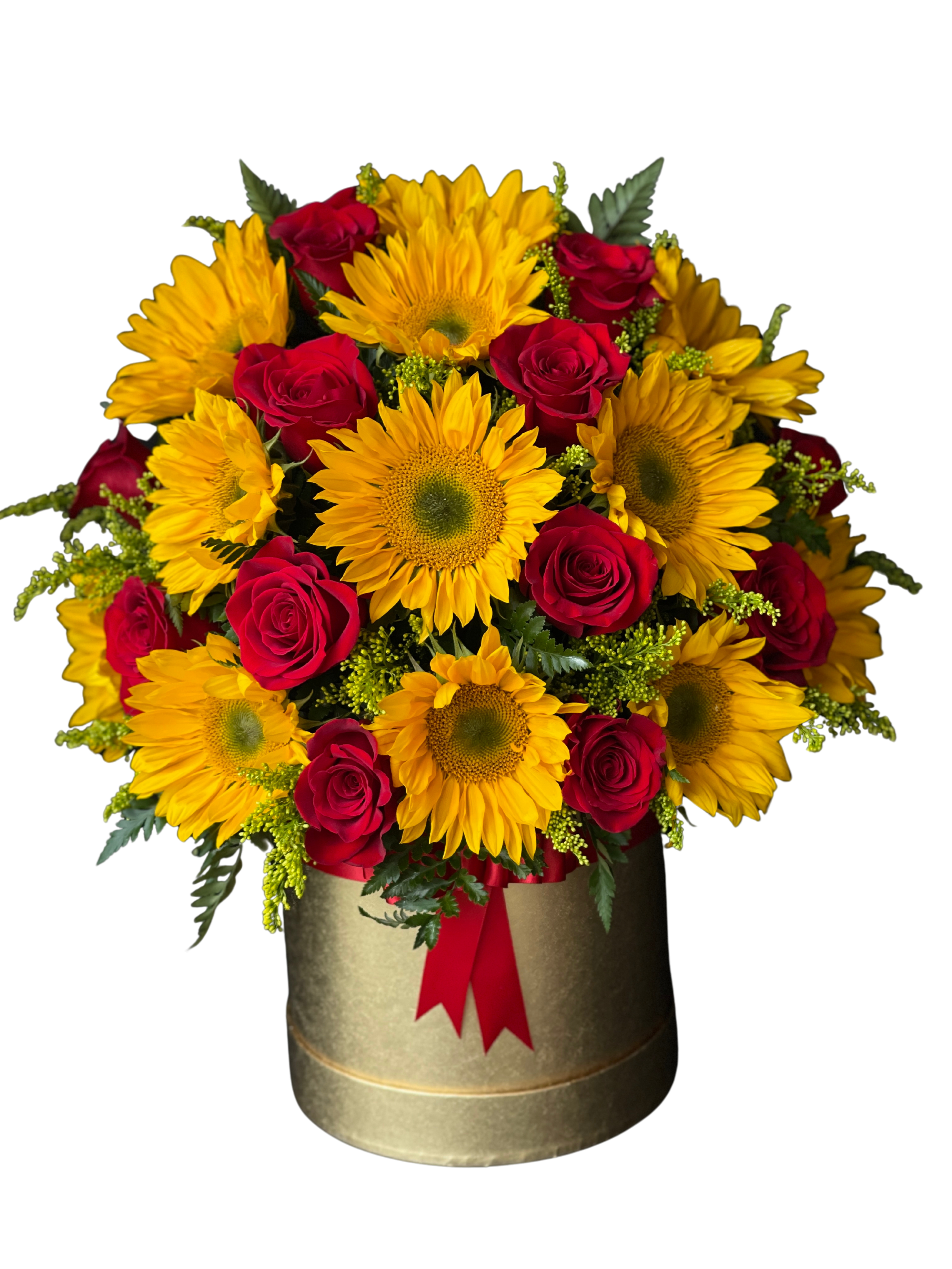 Shiny ball - Bright sunflowers and deep red roses come together in a striking birthday bouquet that reads joyful and a little dramatic - perfect as a congratulations gift or a romantic surprise. The round gold hat box gives the arrangement a polished, gift-ready presentation and the red ribbon at the front adds a classic finishing touch that makes the recipient feel celebrated the moment they see it.  This flower arrangement packs bright yellow sunflowers and rich red roses tightly into a compact, shiny gold box so the blooms read lush and abundant. Small green filler accents weave between the larger flowers to soften the silhouette and add texture, while the red ribbon ties the color story together. The overall palette of yellow, red and green creates warm contrast that pops on a mantel, desk, or dining table.  Choose this arrangement when you want the person you're thinking of to feel noticed-whether it's for a birthday, a big milestone, or to say "I'm thinking of you" with a romantic edge. The gold hat box is ready to display, and the sturdy packaging makes it an easy same-day gift option; order early in the day for best availability.