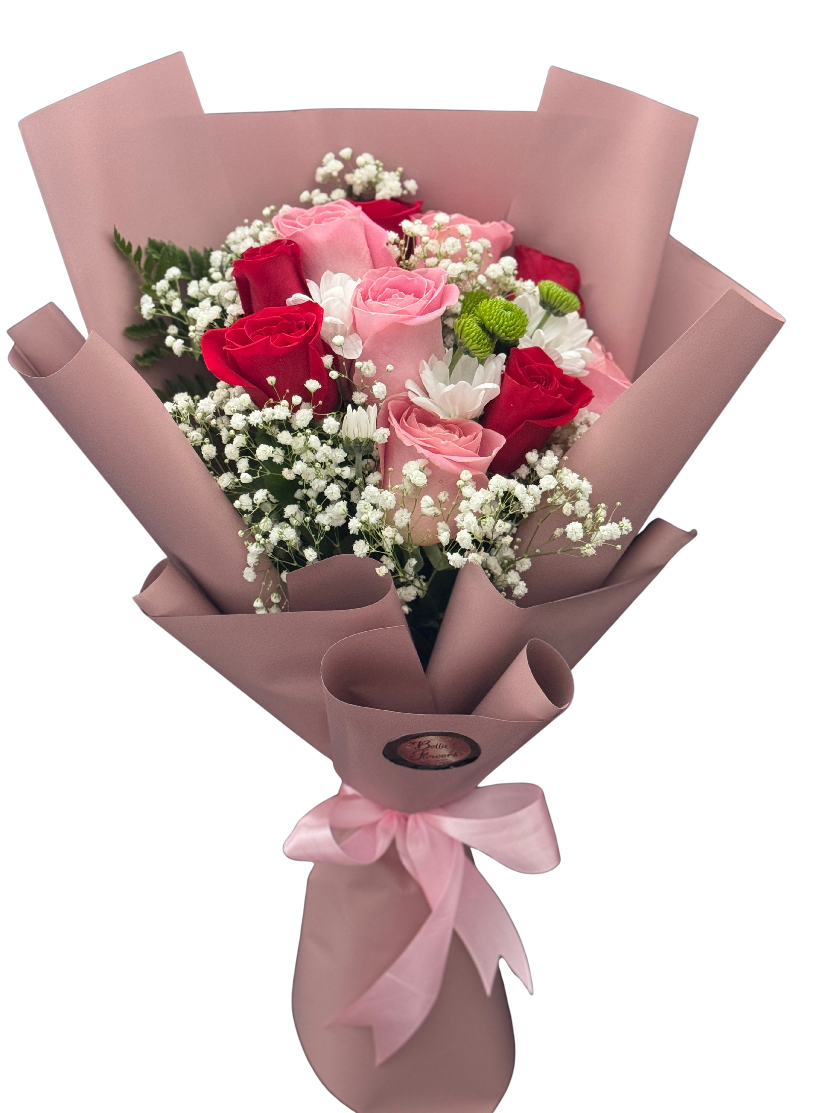 Bouquet of pink and red roses with white filler flowers in pink wrap