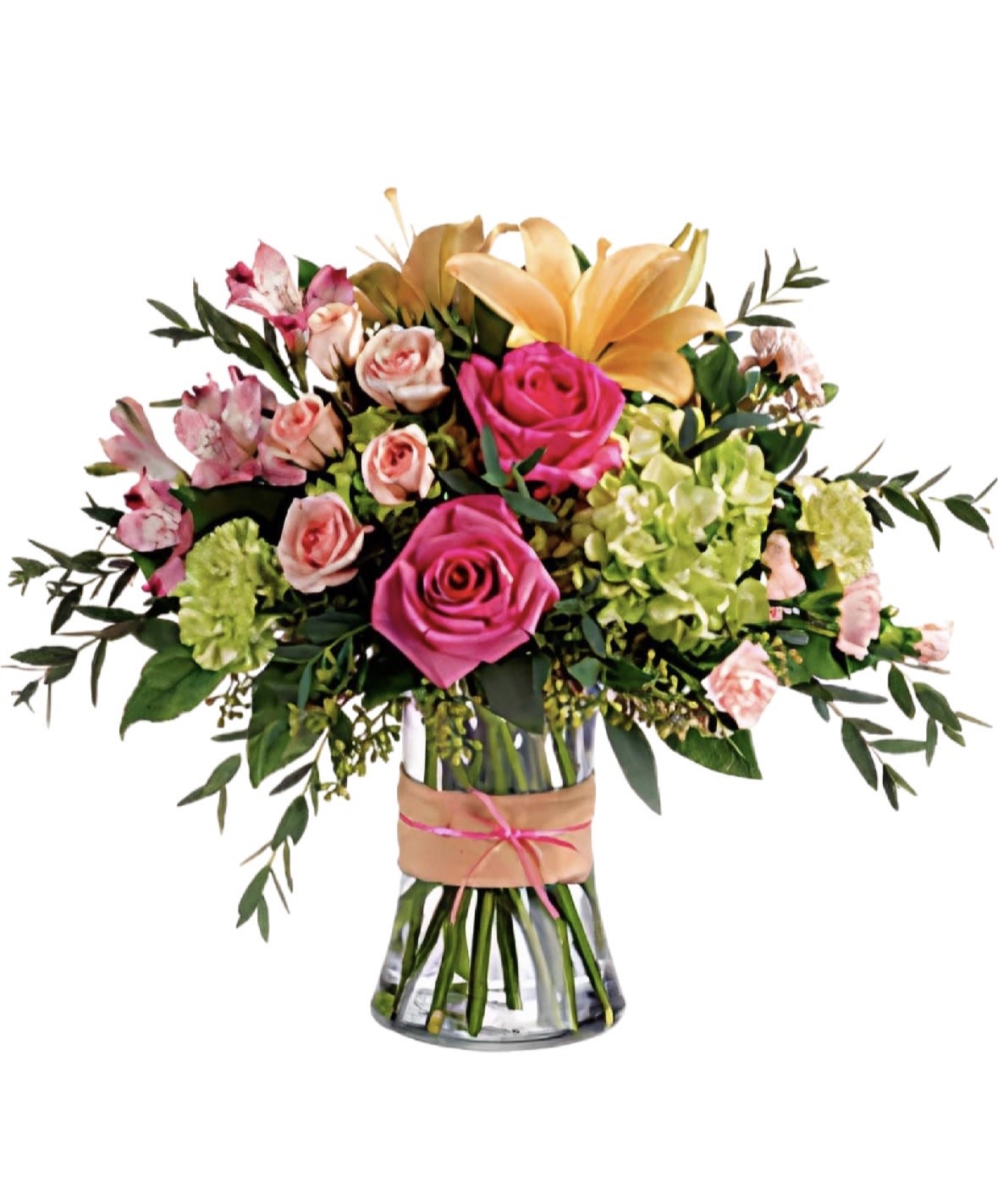 Blush Garden Elegance - A fresh and vibrant floral arrangement designed to brighten any day. This elegant bouquet features a beautiful mix of premium roses, lilies, and seasonal blooms in soft pink, peach, and green tones, thoughtfully arranged in a clear glass vase.  Perfect for birthdays, celebrations, or simply to make someone smile, this design combines natural beauty with a modern, garden-inspired style.