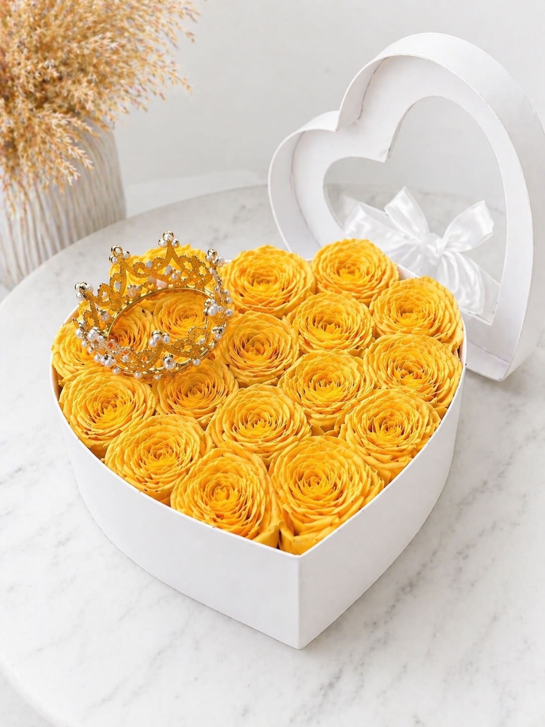 Golden Queen Yellow Rose Heart - Luxury heart-shaped box filled with premium yellow roses, beautifully arranged for a full and elegant look.  Finished with a delicate crown detail for a royal and sophisticated touch.  Perfect for Mother’s Day, birthdays, or any special occasion.