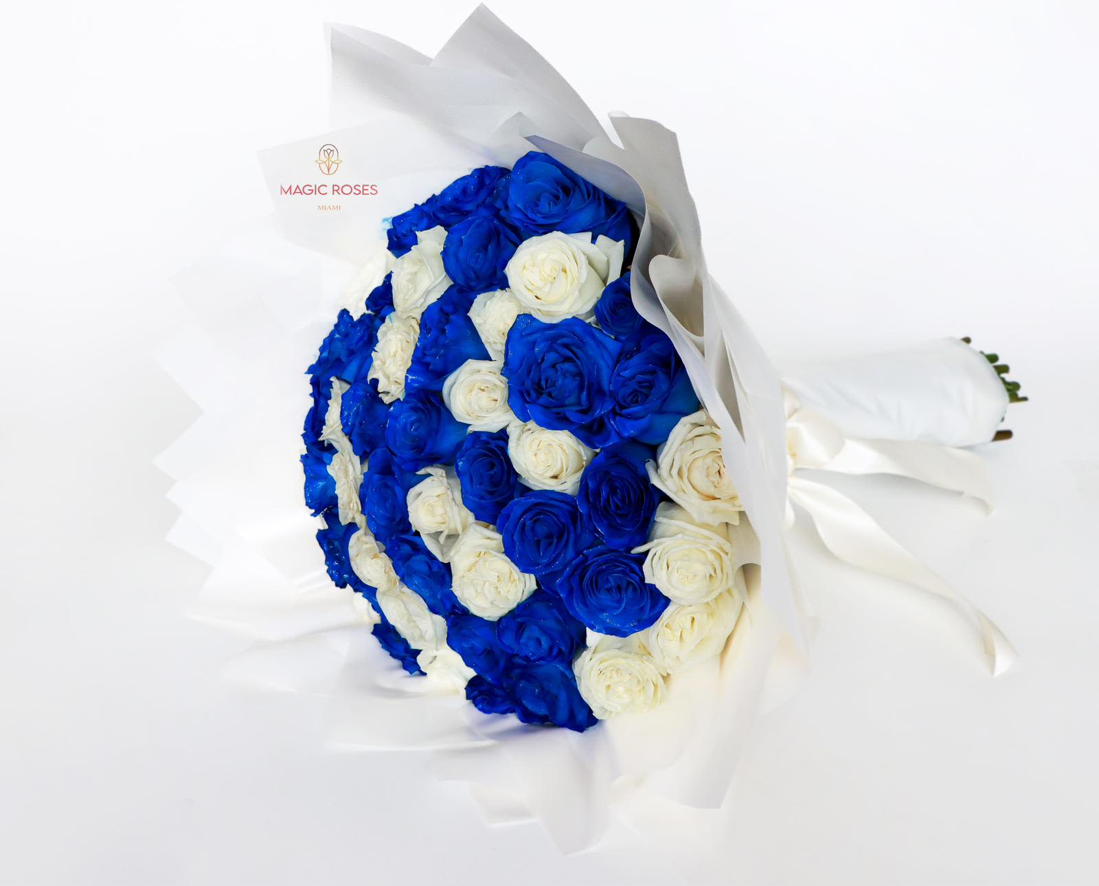 Ocean Whisper Bouquet  - 50 Luxury roses royal blue and  white roses wrapped into a rounded, full cluster that reads both bold and romantic - a birthday bouquet or anniversary roses that makes the recipient feel celebrated and truly seen. The Ocean Whisper Bouquet is a polished choice for birthdays, anniversaries, congratulations, or any moment you want to mark with striking color and classic romance. 