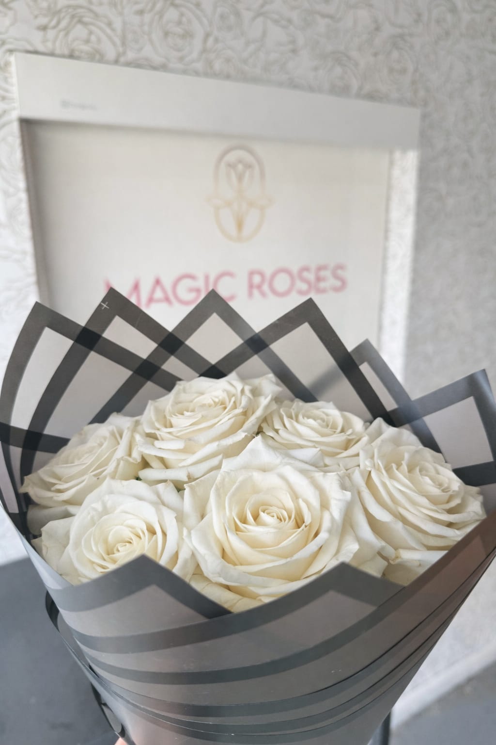 White Mondial Elegance - Dozen Roses - Experience timeless beauty with our White Mondial Elegance Bouquet. This stunning arrangement features premium White Mondial roses, known for their large blooms, creamy petals, and luxurious appearance. Hand-wrapped in modern designer packaging, this bouquet is perfect for women's day, mother's day, anniversaries, birthdays, sympathy gestures, or simply expressing love and appreciation.