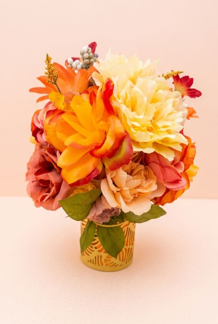 Citrus path - Sun-drenched citrus slices mingle with vibrant marigolds and yellow roses to create a refreshing, aromatic journey. This arrangement captures the essence of a bright orchard walk in peak summer.