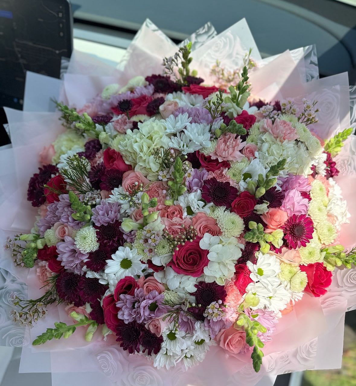 Mixed blooms perfection - This is a grand XL mixed blooms bouquet, she will love this one for sure!   We arrange 50 roses with a variety of lots of mixed blooms (you choose a natural color for the roses, and we will match everything else)