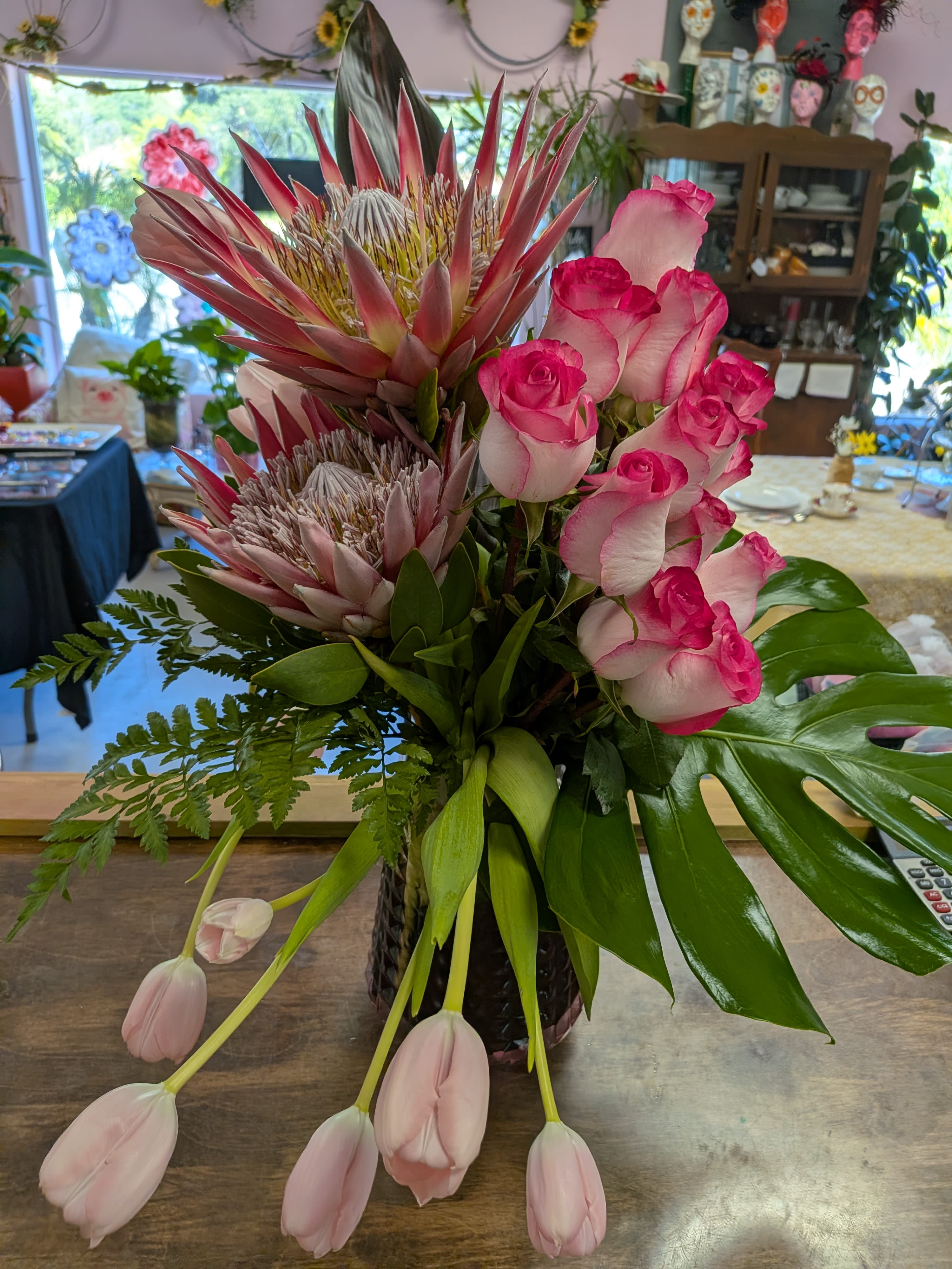 Pretty in pink - Large proteas flowers with roses and tulips