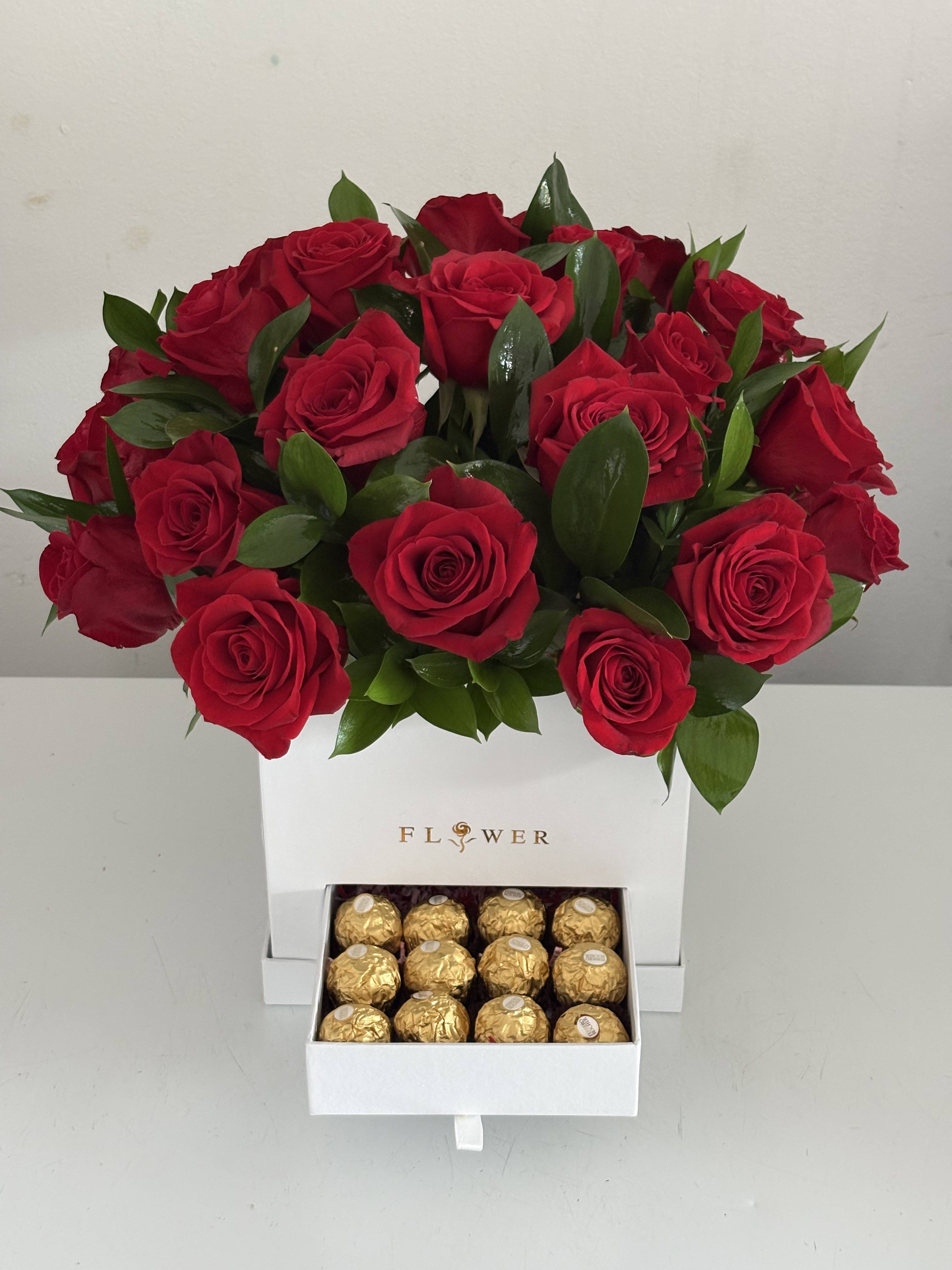 Red rose arrangement in a white box with a drawer of gold chocolates