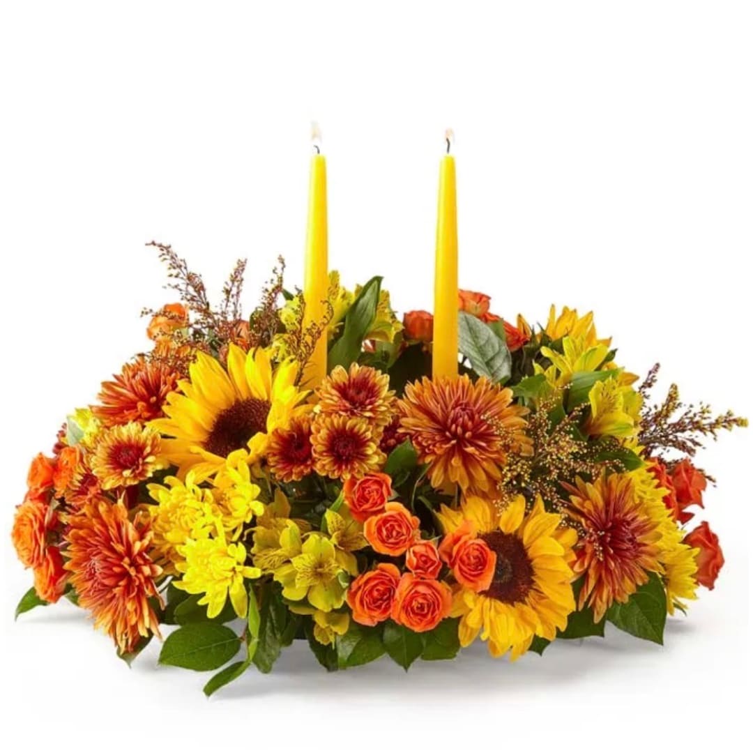 Autumn floral centerpiece with two yellow candles