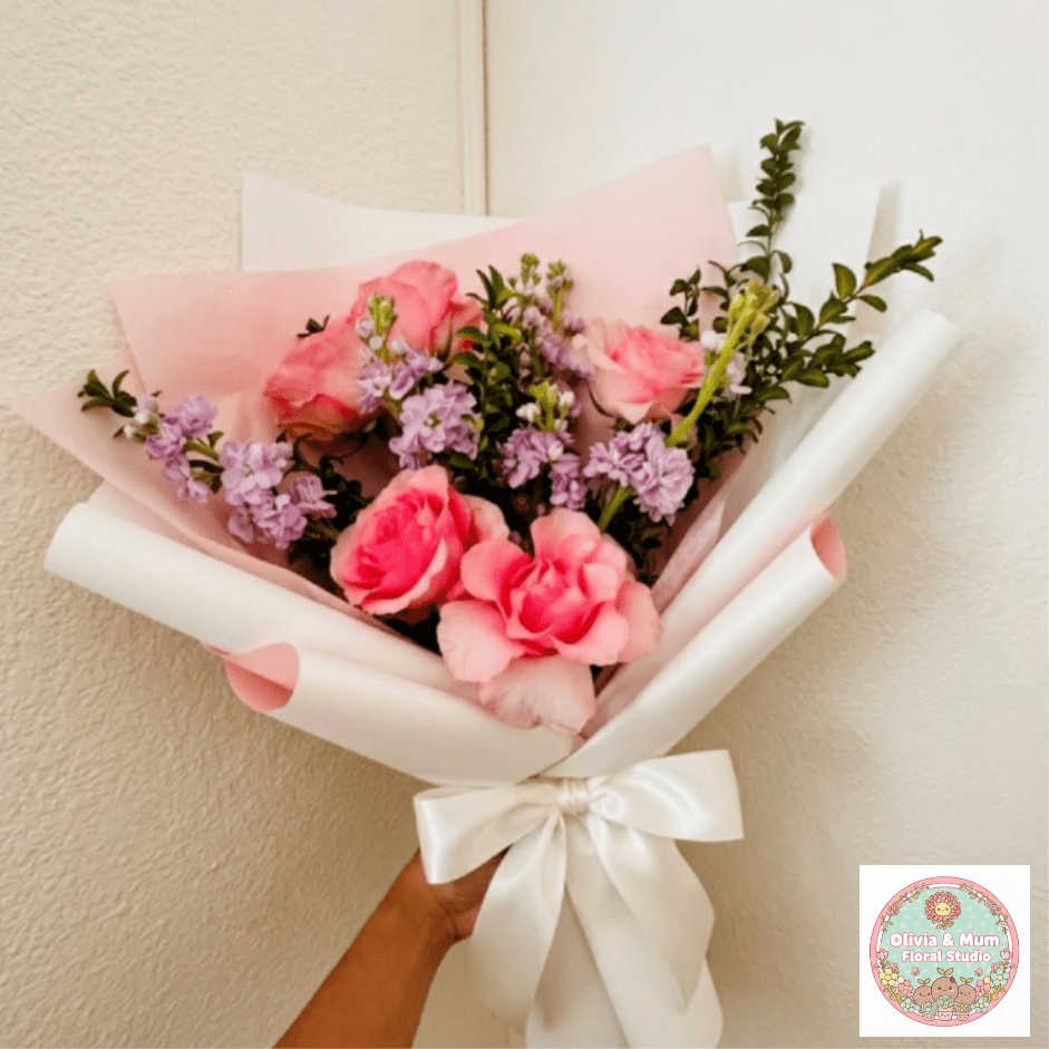 Memory Lane - Tender, nostalgic, and heartfelt—Memory Lane celebrates the precious memories of a loved one. Soft pink roses and fragrant lavender stock offer a bit of color and scent to a heavy heart during a difficult time.  This seasonal bouquet features:  Premium Light Pink Roses  Lavender Stock  Fresh Boxwood  Garden Greens  Presentation: Expertly wrapped in our signature textured paper and tied with satin ribbon. Prefer a vase? Add one to your cart to complete the look.  Personal Touch: We’ll include a custom card message with every order. You’ll be able to write your message at checkout.  Please Note: All flowers are subject to seasonal availability. If a specific bloom isn’t available, our designers will thoughtfully substitute with flowers in a similar shape, style, and color.  Standard size shown. Vase upgrade is optional.   Floral Care Guide  Your arrangement arrives in our signature "double wrap" and is nestled in a protective box. While the stems are secured with a wet wrap for transit they are ready for a full drink!   Unpack: Gently lift the bouquet from the box. Remove the plastic bag and wet towel from the stems. Trim &amp; Hydrate: Trim 1/2" off stems at an angle and place in a clean vase with cool water. Refreshed: Change water daily for a long-lasting bloom. 