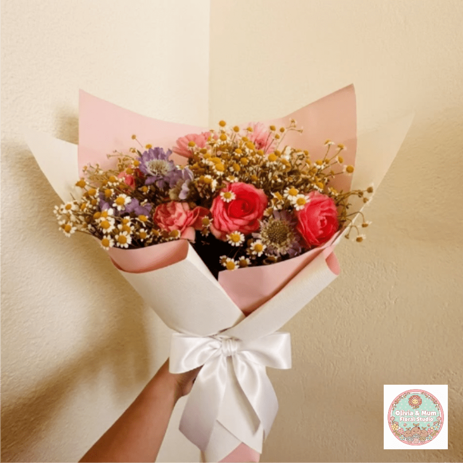 Confetti Blast - Exciting, diverse, and full of life—Confetti Blast is a floral explosion of color and texture. The mix of scabiosa, ranunculus, and feverfew creates a festive visual experience that is truly a party in a bouquet.  This seasonal bouquet features:  Lavender Scabiosa  Hot Pink Ranunculus  Petite White Feverfew  Garden Greens  Presentation: Expertly wrapped in our signature textured paper and tied with satin ribbon. Prefer a vase? Add one to your cart to complete the look.  Personal Touch: We’ll include a custom card message with every order. You’ll be able to write your message at checkout.  Please Note: All flowers are subject to seasonal availability. If a specific bloom isn’t available, our designers will thoughtfully substitute with flowers in a similar shape, style, and color.  Standard size shown. Vase upgrade is optional.   Floral Care Guide  Your arrangement arrives in our signature "double wrap" and is nestled in a protective box. While the stems are secured with a wet wrap for transit they are ready for a full drink!   Unpack: Gently lift the bouquet from the box. Remove the plastic bag and wet towel from the stems. Trim &amp; Hydrate: Trim 1/2" off stems at an angle and place in a clean vase with cool water. Refreshed: Change water daily for a long-lasting bloom.  
