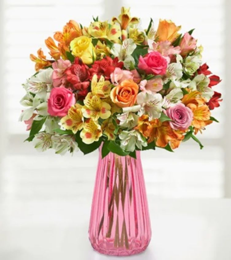 Birthday Radiance Bouquet - Bright, joyful, and bursting with color — our Birthday Radiance Bouquet is the ultimate celebration of life and happiness! Featuring a vibrant mix of roses in pink, red, orange, yellow, and white, paired beautifully with playful alstroemeria blooms, this arrangement captures the essence of a perfect birthday wish. Arranged in a classic glass vase, it’s a cheerful gift that delivers sunshine, smiles, and love straight to their doorstep.
