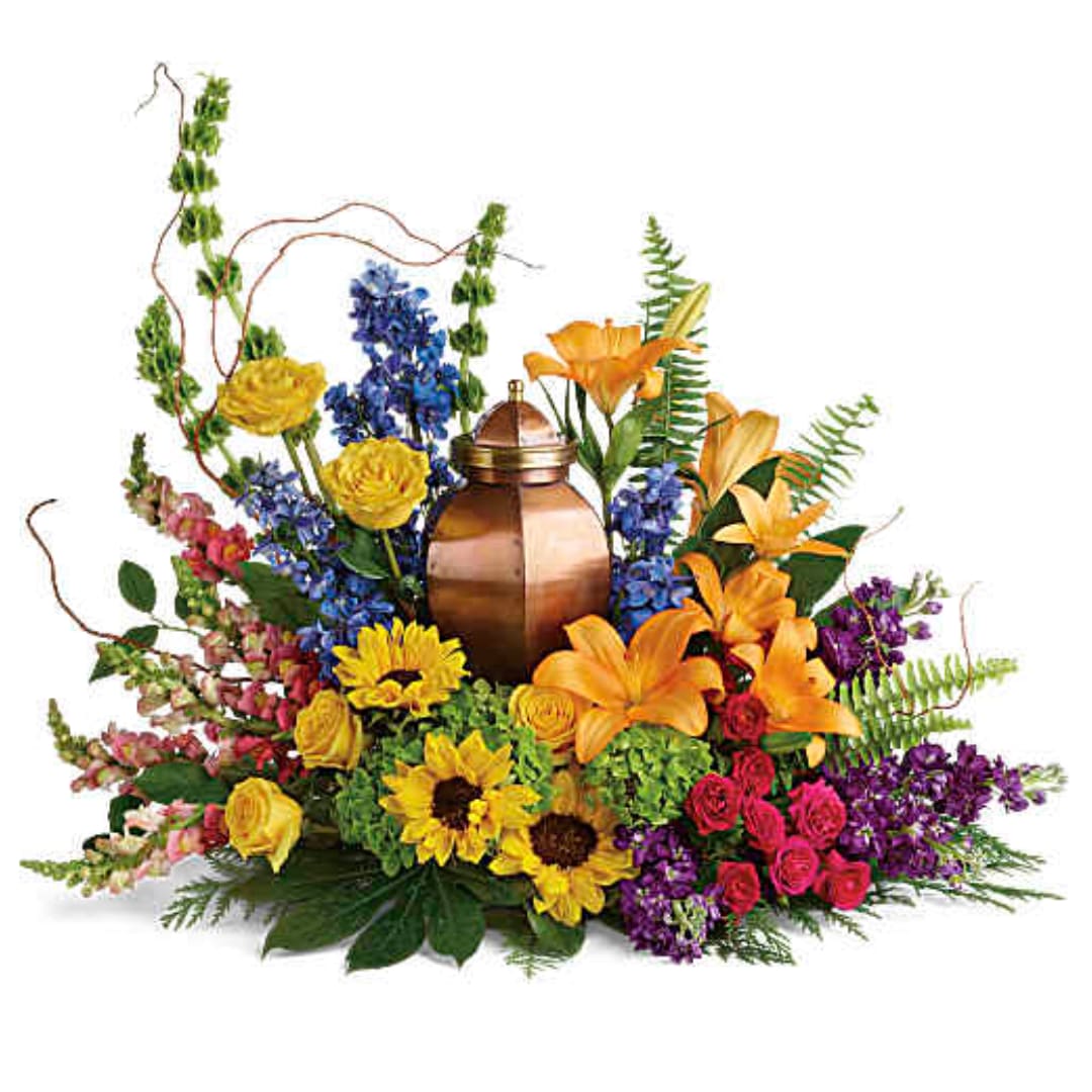 Colorful floral arrangement with a copper urn centerpiece