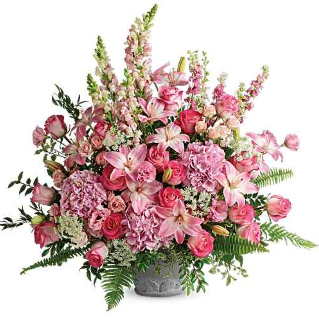 Pink mixed flower arrangement in a gray vase