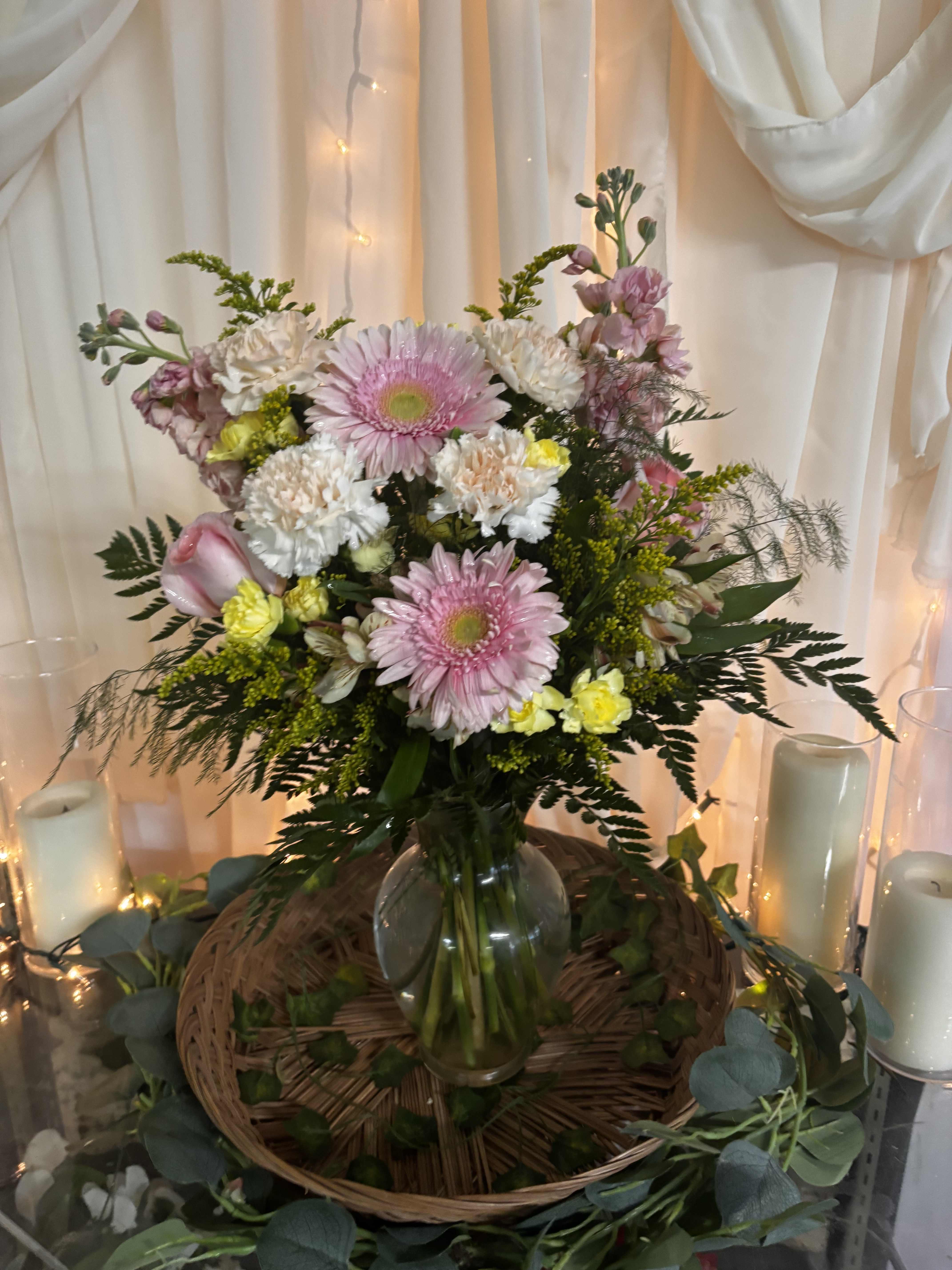 Pink and white mixed bouquet in a glass vase