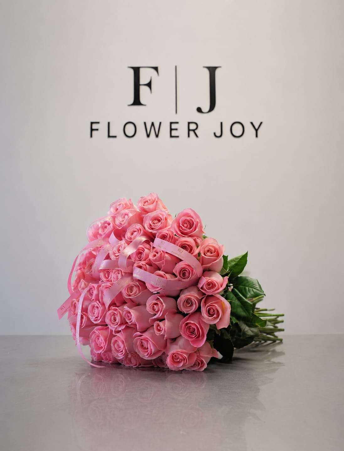 Rosy Charm  - A beautiful bouquet of vibrant pink roses, finished with elegant ribbon details. A sweet and stylish gift for birthdays, congratulations, or a thoughtful surprise.