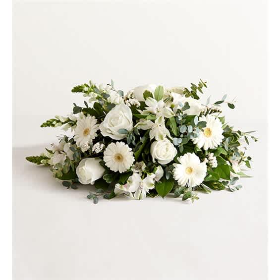 White floral arrangement with roses and daisy-like blooms