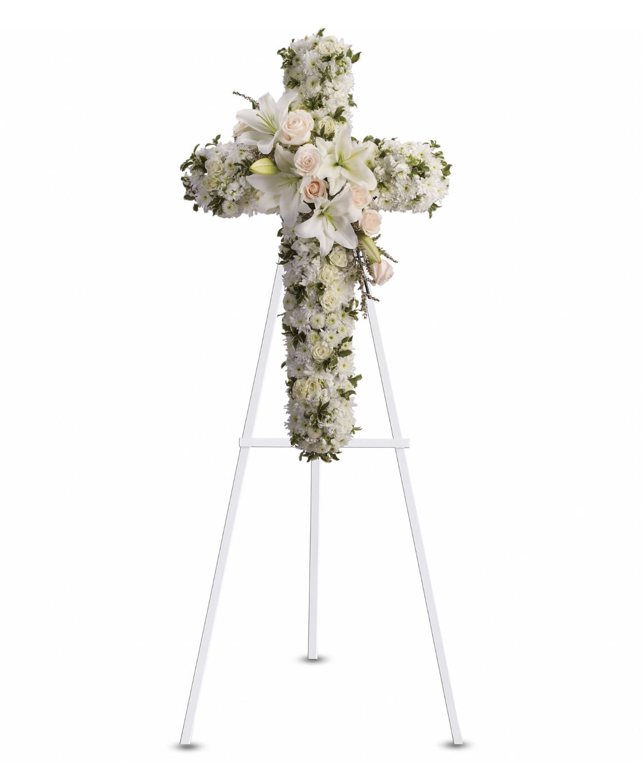 Divine Light - A serene floral cross shaped for reverent remembrance, this sympathy arrangement presents white lilies, chrysanthemums and soft blush roses on a white metal easel stand-an ideal funeral tribute. The cross silhouette and predominantly white palette with touches of green and pink offer a classic, comforting presence that honors the person you're thinking of and communicates sympathy with quiet grace.  Dense, symmetrical blooms create full coverage across the cross: creamy lilies and white chrysanthemums form the luminous backdrop while pale pink roses and verdant greenery provide gentle contrast and softness. Mounted on a sturdy white metal easel, the piece reads formal and traditional from a distance and holds its shape through services and viewings.  Appropriate for services, memorials, or to send to a family at home, this arrangement conveys solemn respect and heartfelt condolence. If you need delivery timed for a funeral or viewing, please include service details at checkout so we can ensure timely placement.